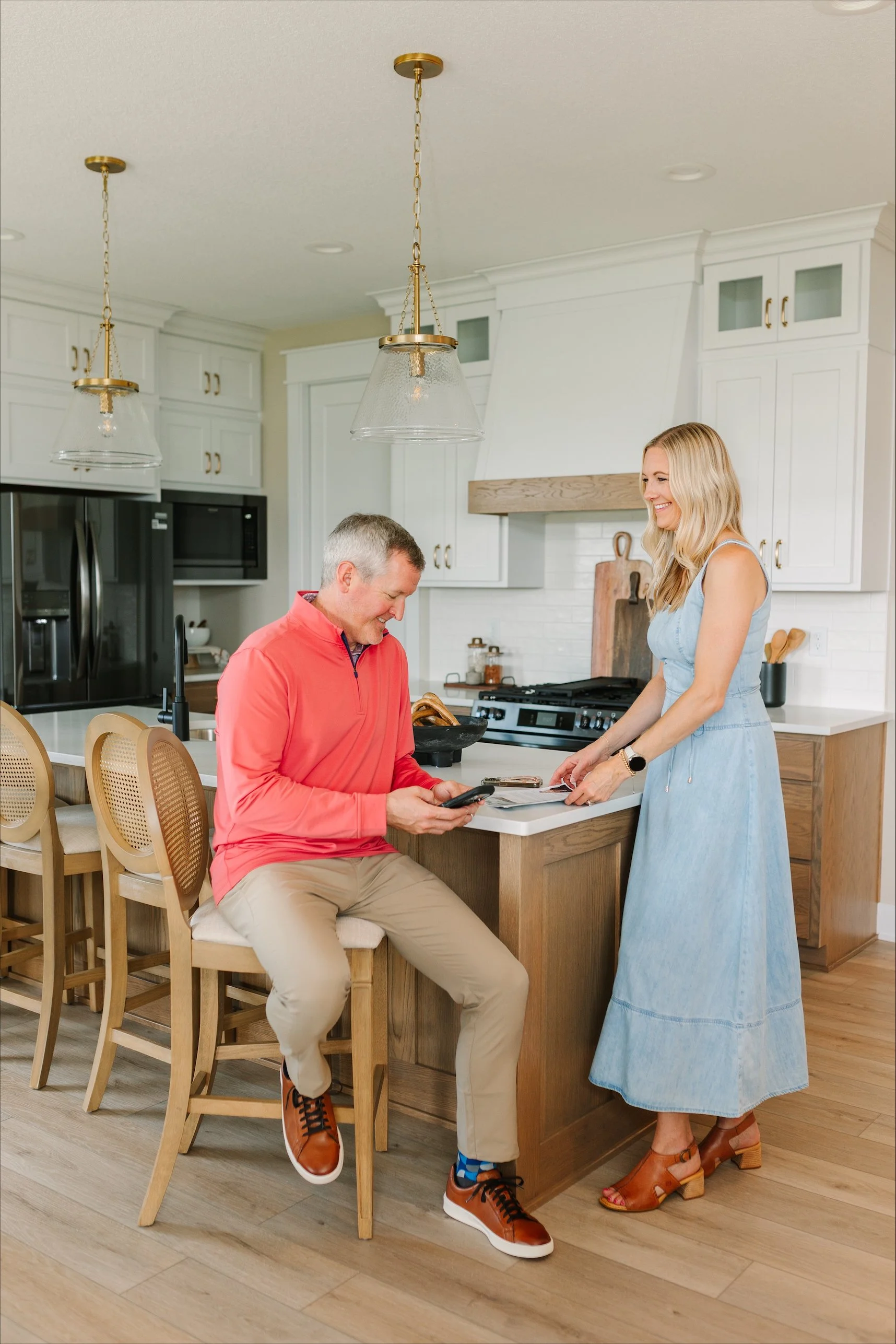 Abby and Drew Conley reviewing real estate details in a Central Iowa home