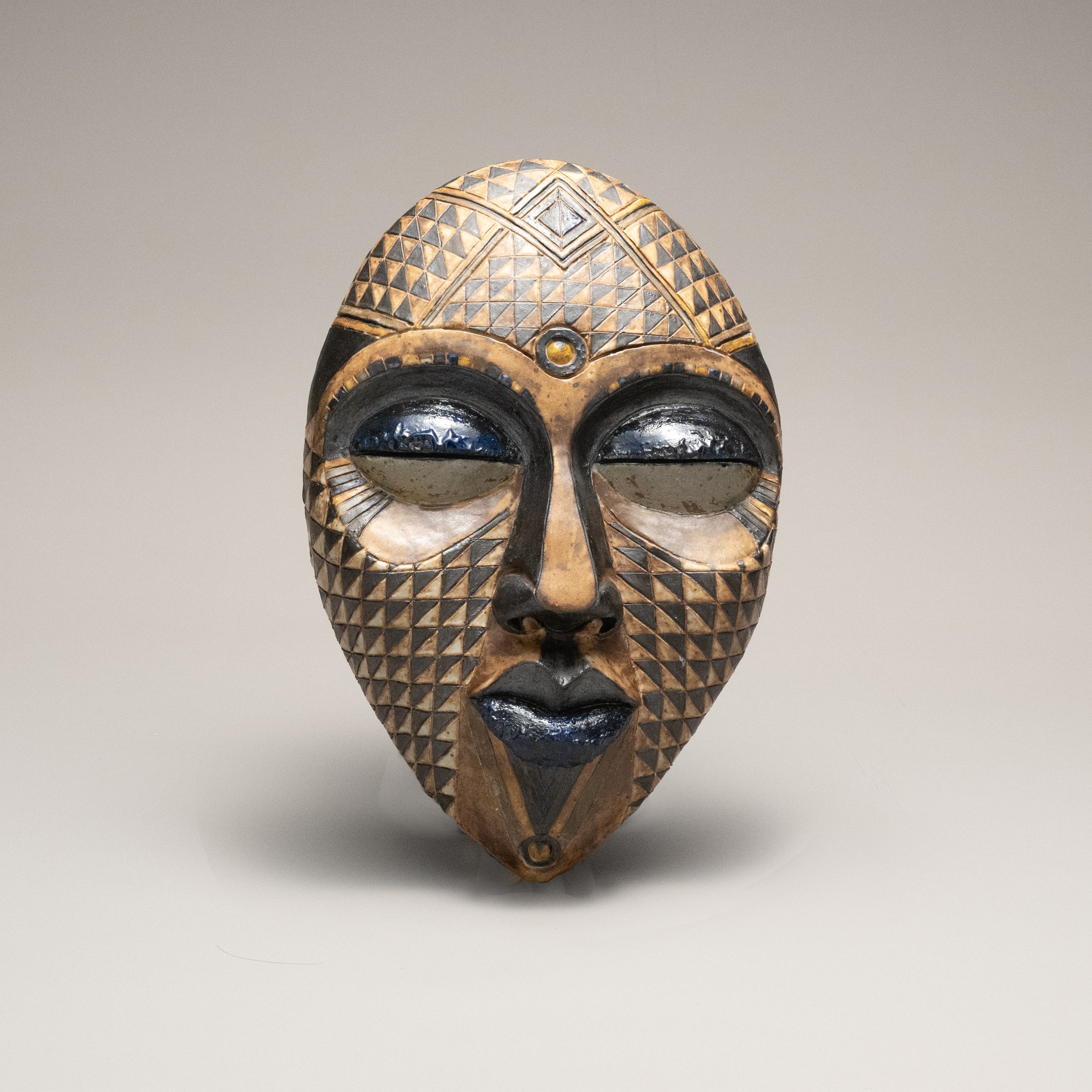 Serene Garden Art: Ceramic African Mask