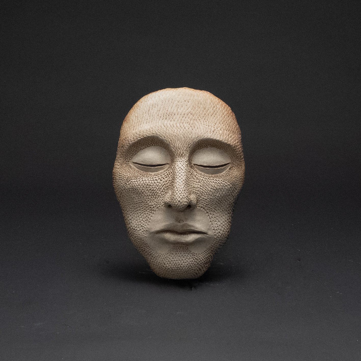 Serene Garden Art: Mysterious Scaly Faced Man