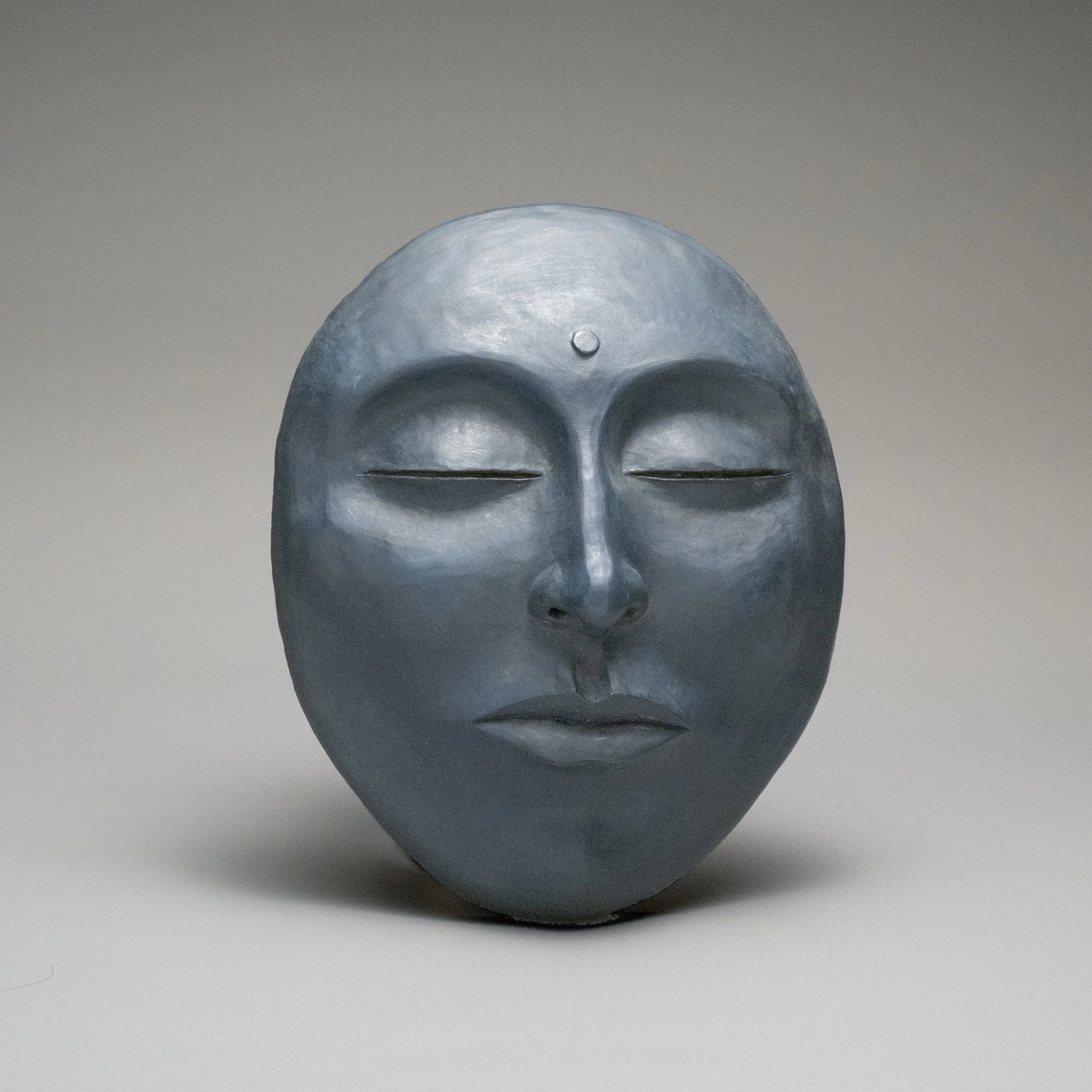 Serene Garden Art:  Deep Blue Buddha Face