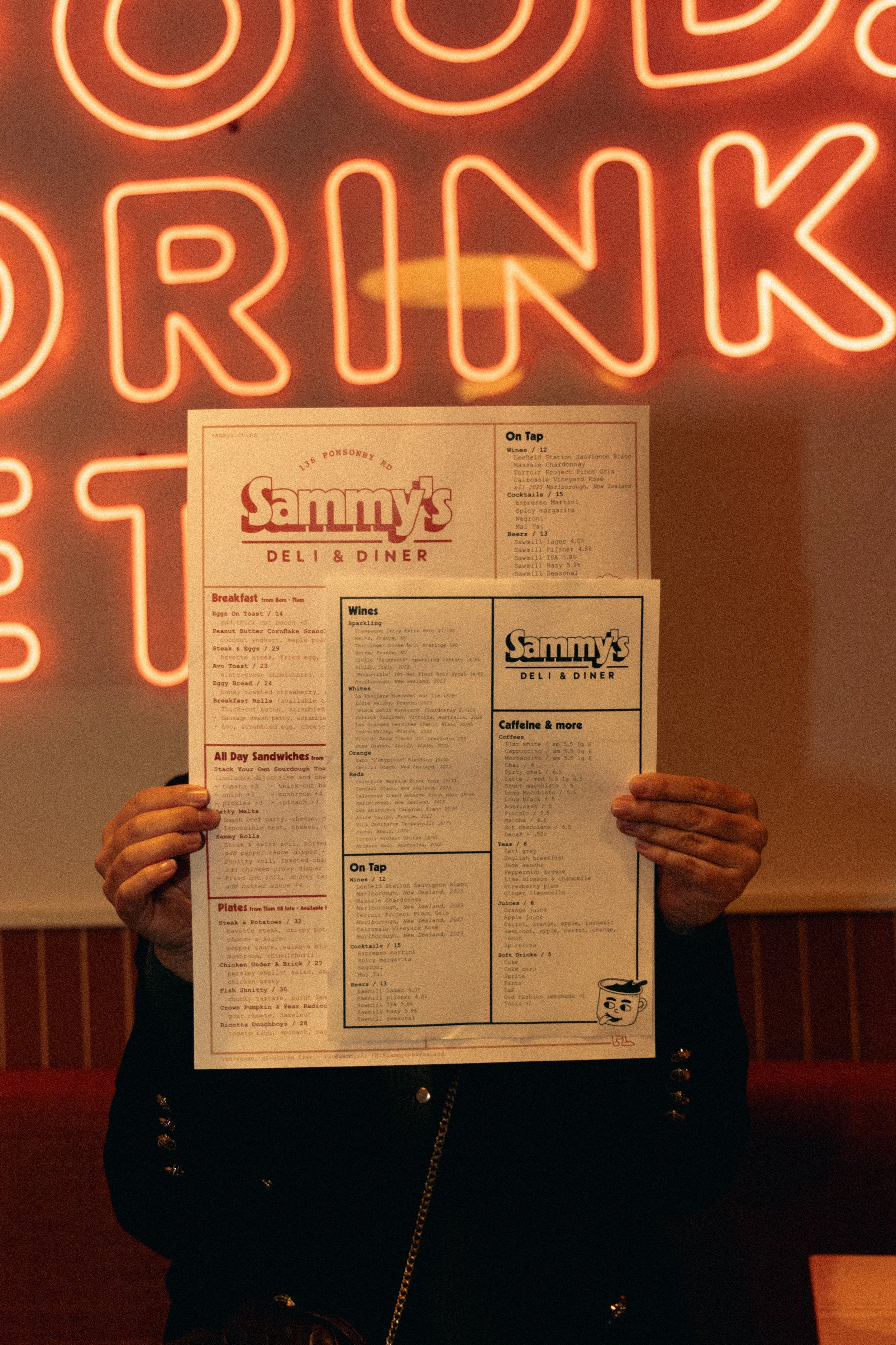 Brand identity for Sammy's Deli & Diner featuring custom menu design displayed in the restaurant as part of the brand experience.