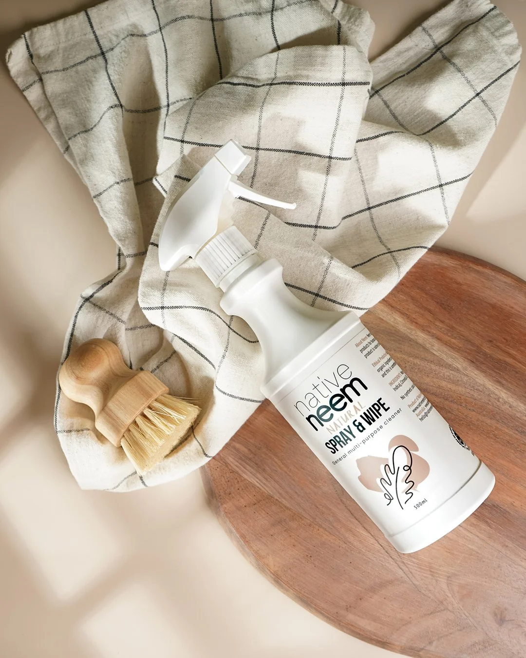 Lifestyle product photography of Native Neem pet shampoo, showcasing natural pet care packaging in a warm, styled setting.