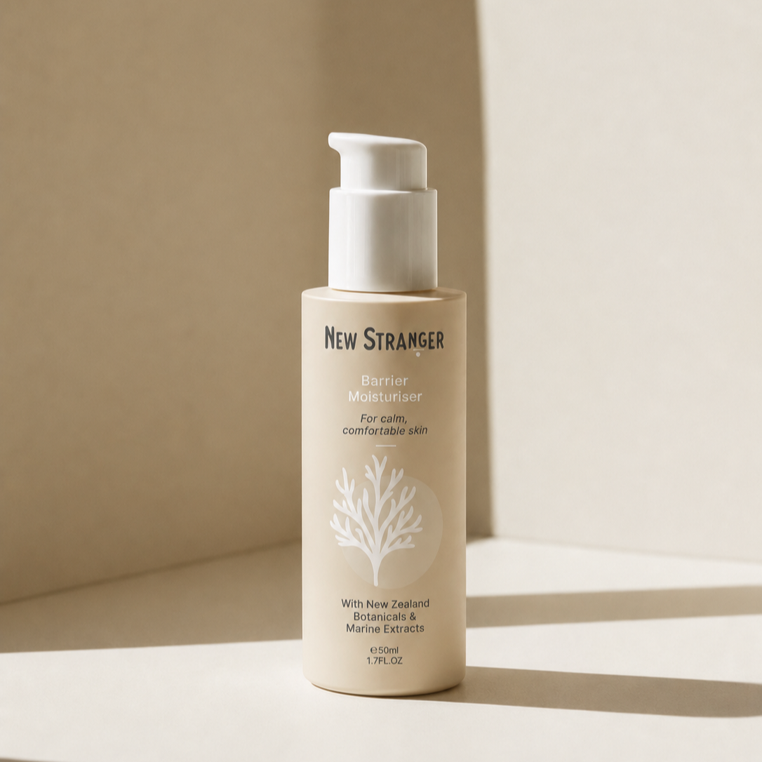 Bottle of New Stranger Barrier Moisturiser with a white pump, featuring a minimalist design with a white tree illustration, placed on a neutral background.