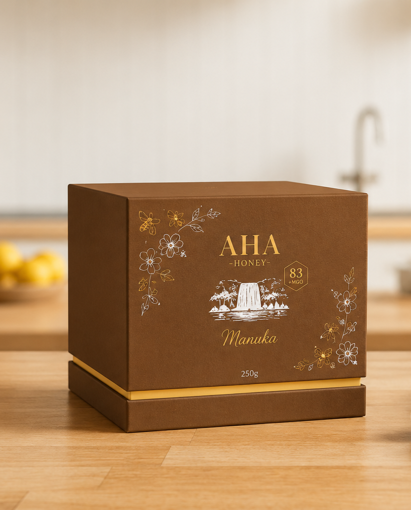 Lifestyle product photography of the AHA Honey Manuka honey gift box displayed in a modern kitchen, showcasing the premium packaging refresh created by Aura Studio.