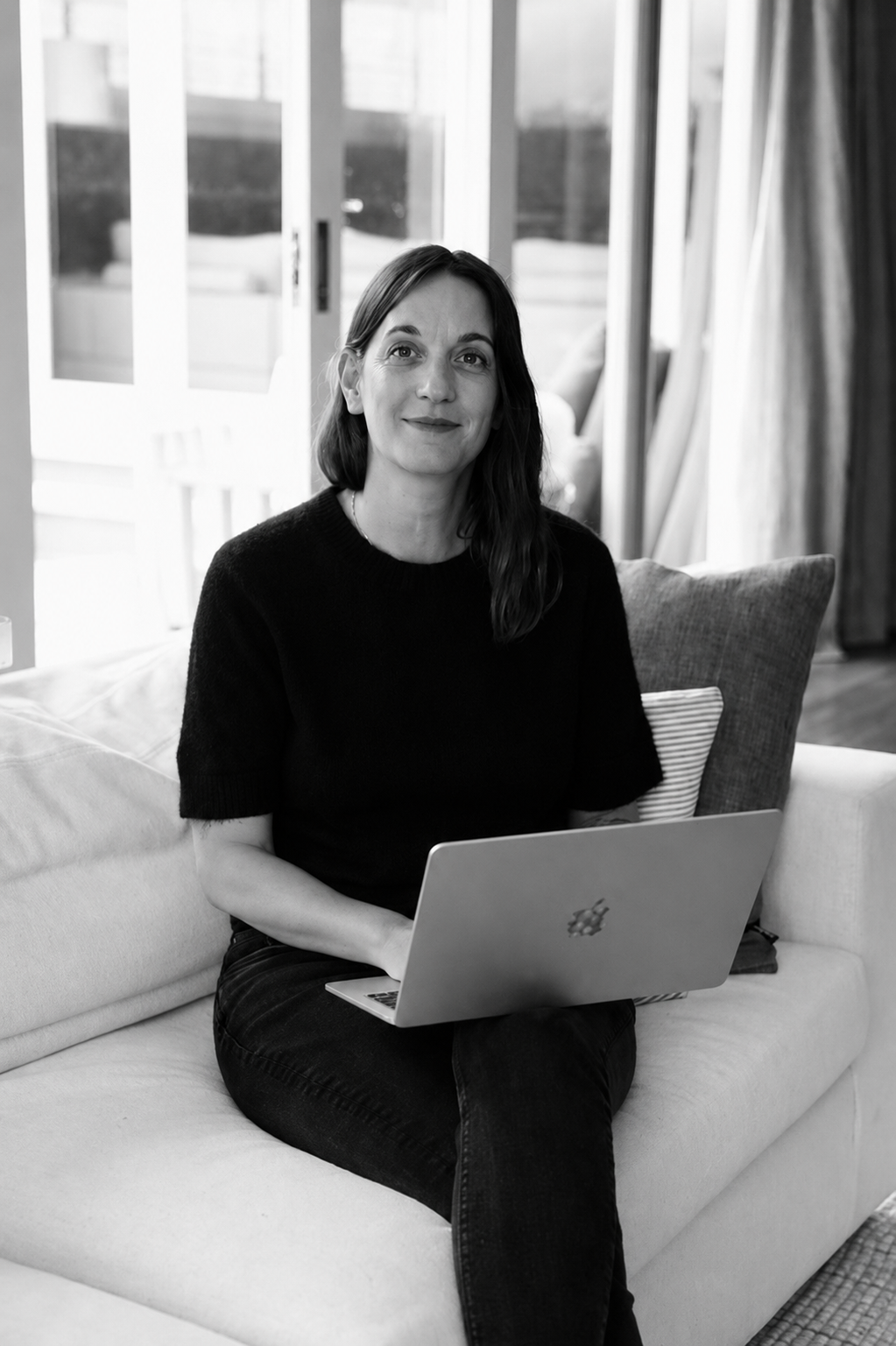 Black-and-white portrait of Emma from Aura Studio, an Auckland brand and marketing studio.