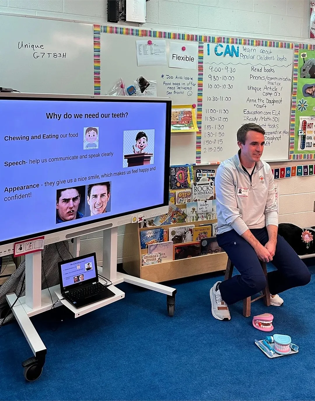 Dr. Jeff Cronley in a classroom teaching kids about teeth.