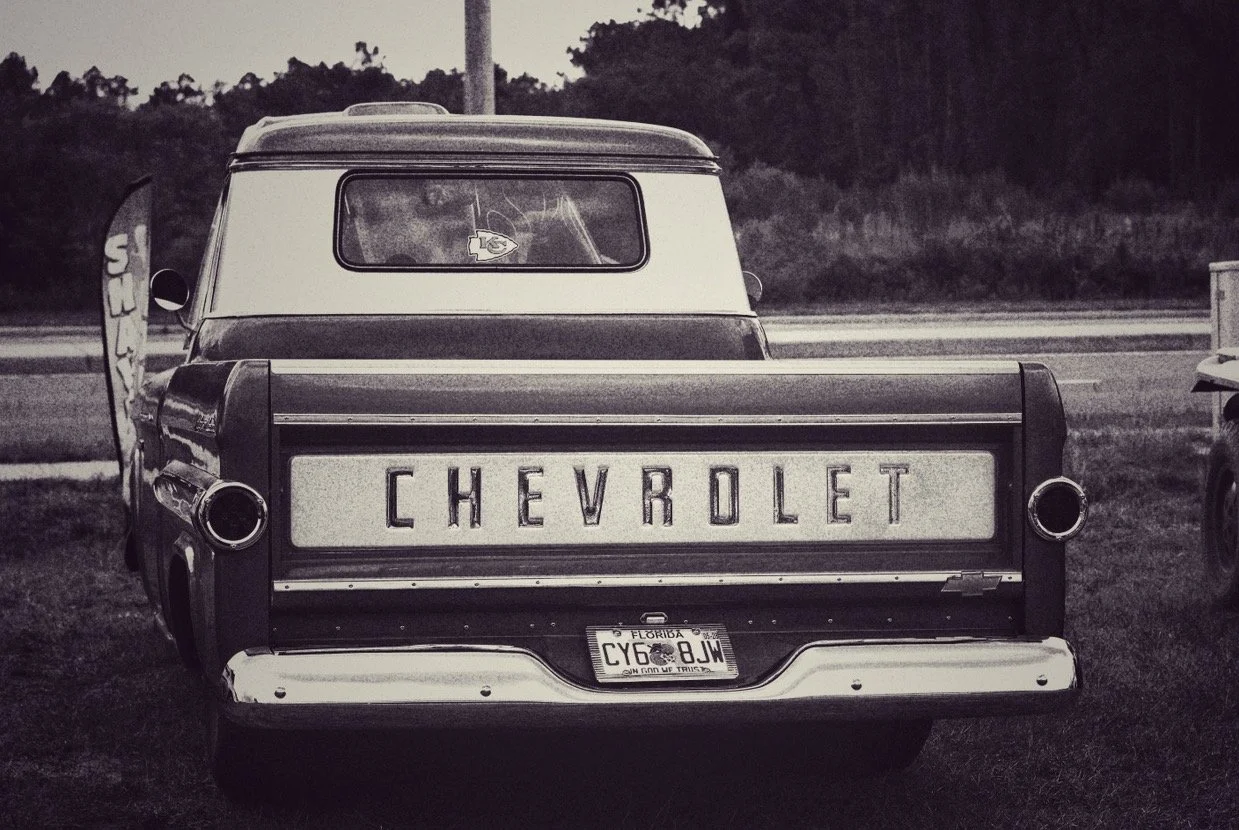 Black and white photo of an old Chevrolet pickup truck with a Florida license plate.