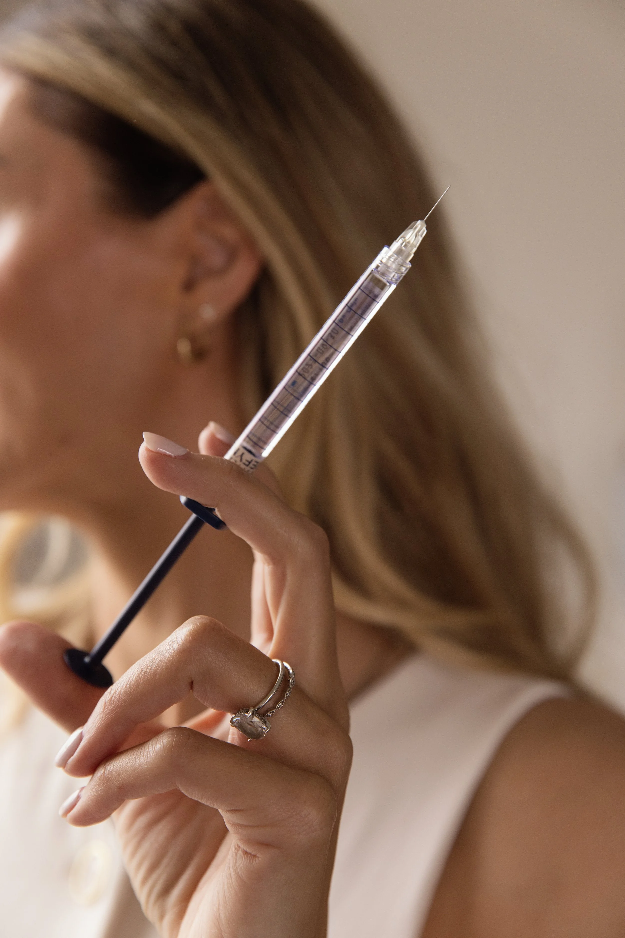 Nurse practitioner preparing an injectable treatment at Ansa Aesthetics