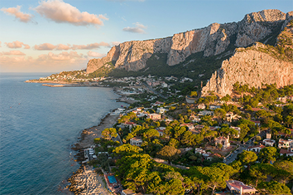 Mondello / Sicily coastline: 
Coastal landscape of Mondello, Palermo, Sicily, framed by mountains and the Mediterranean Sea.