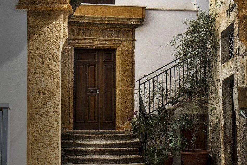 Historic doorway and stone architecture representing belonging, memory, and cultural identity.
