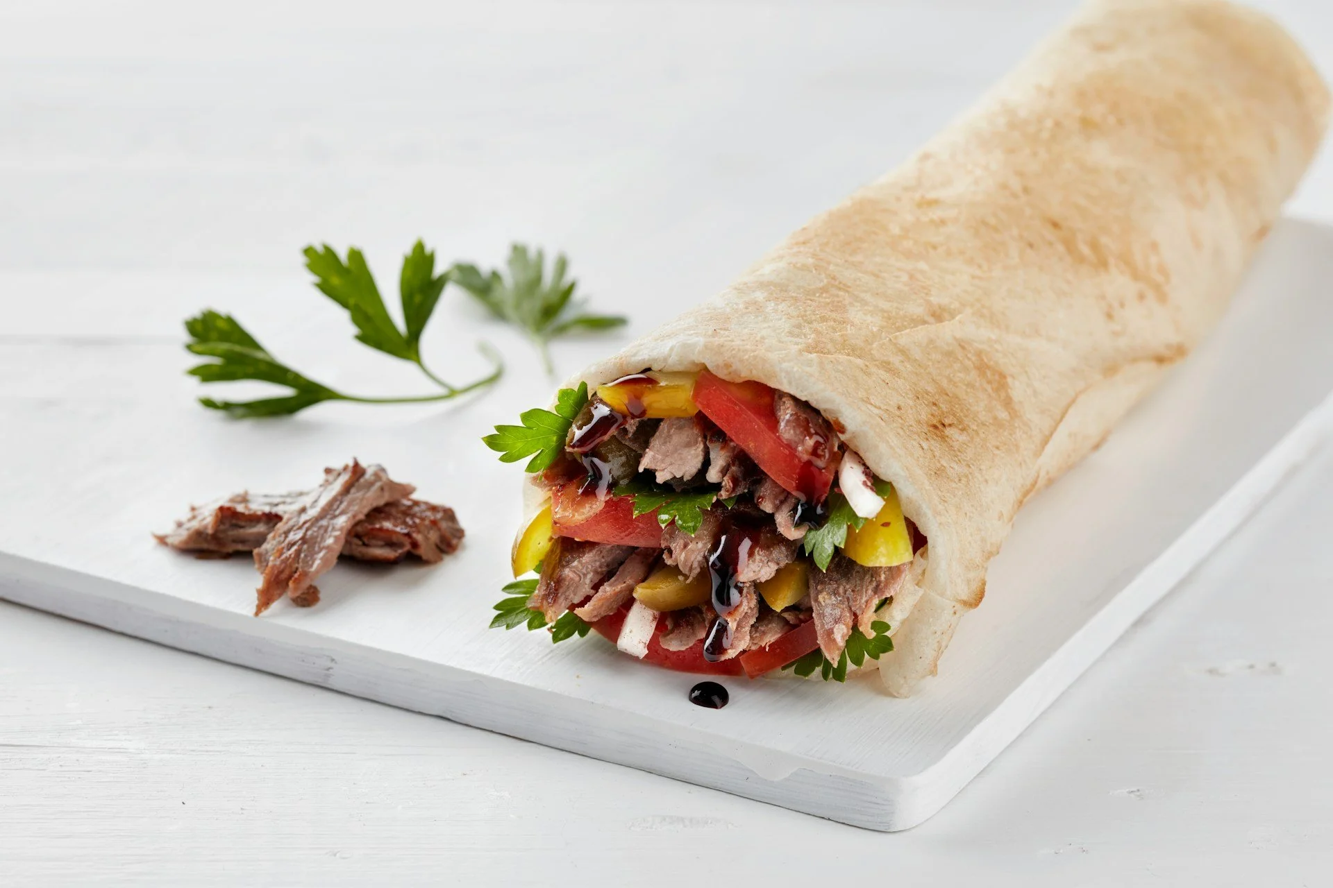 Freshly prepared meat and vegetable wrap representing the food, hospitality, and culinary storytelling of My Halal Kitchen.