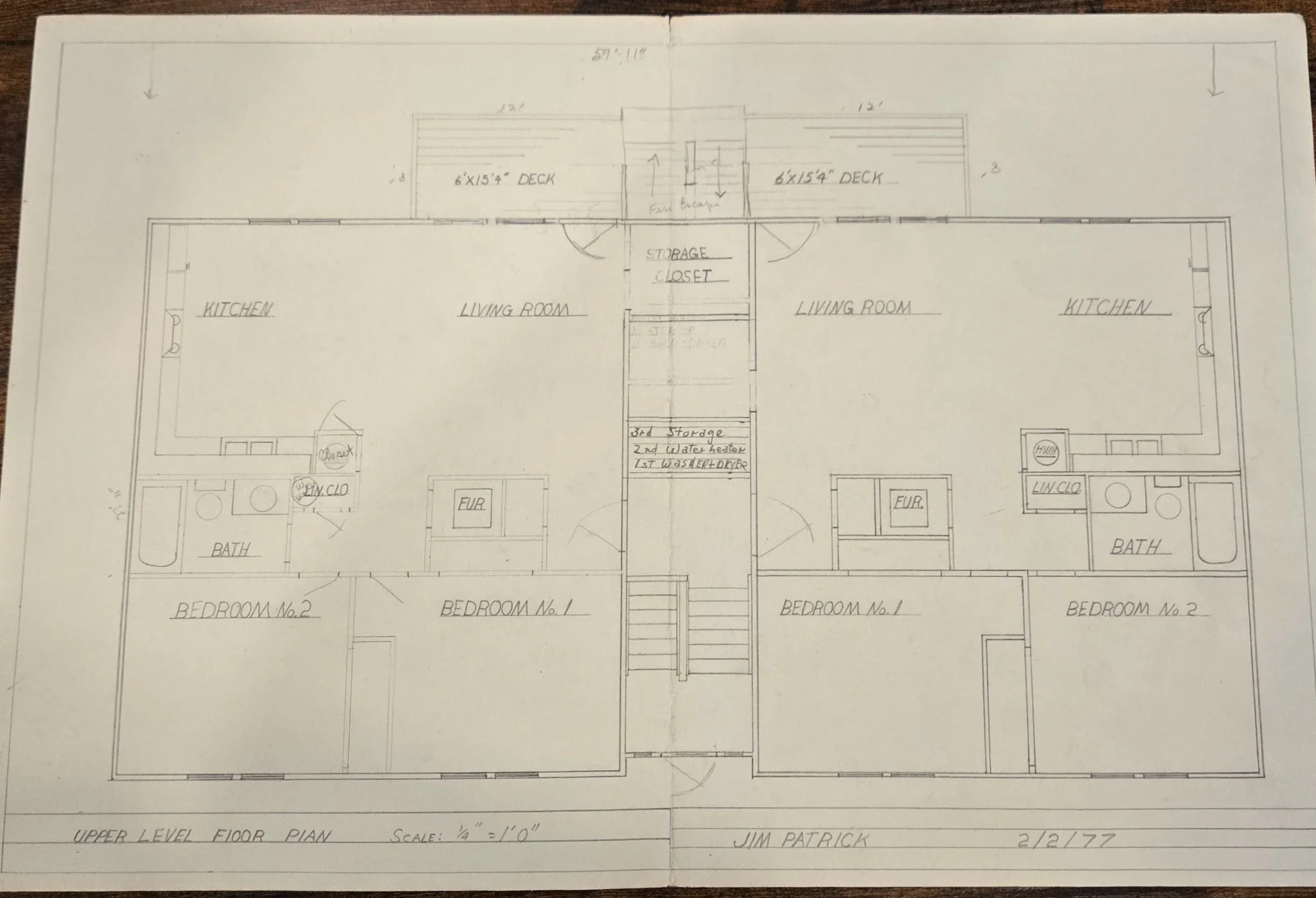 Original 1977 upper-level floor plan by Jim Patrick showing mirrored apartment layouts with kitchens, living rooms, bedrooms, baths, decks, and shared stair access.