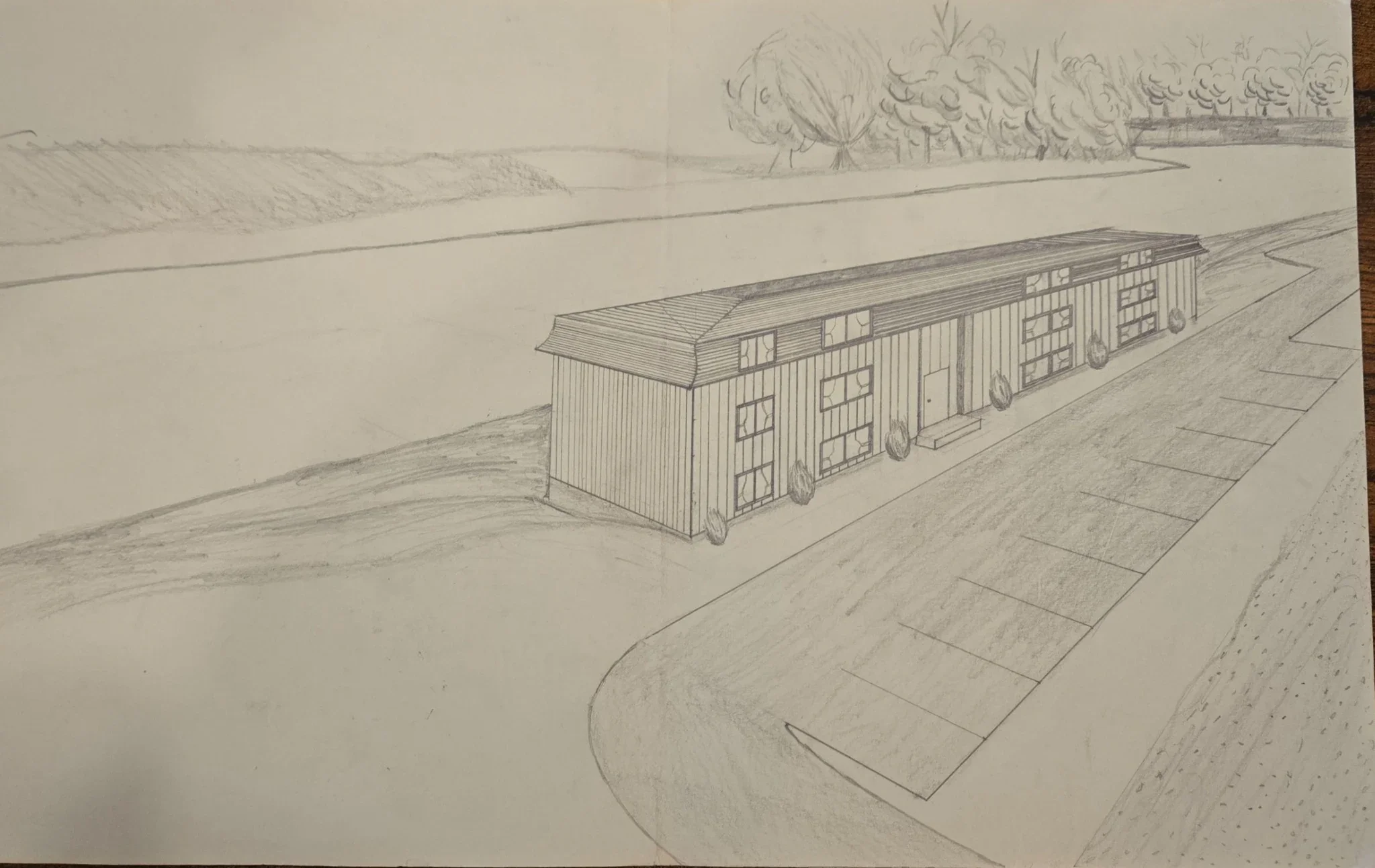 Hand-drawn 1977 perspective rendering of Jim Patrick’s first apartment building design showing a three-story residential building near a road and landscape.
