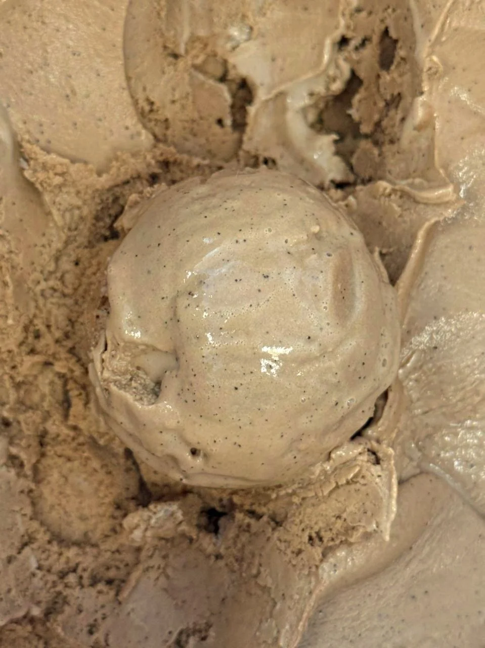 Close up of a brown scoop of Espresso ice cream