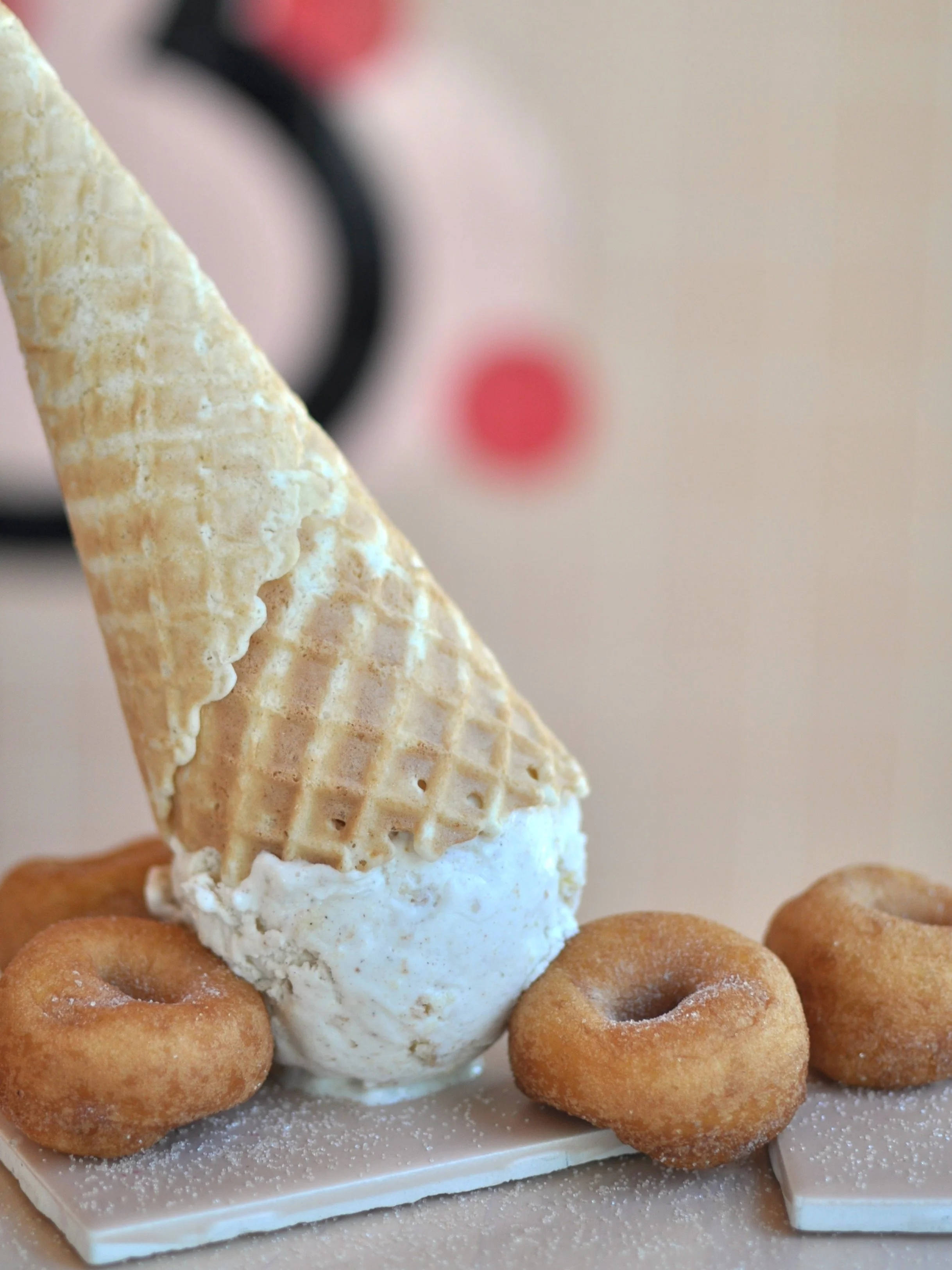 Upside down ice cream cone of the Mini Donut flavour with round mini donuts.
