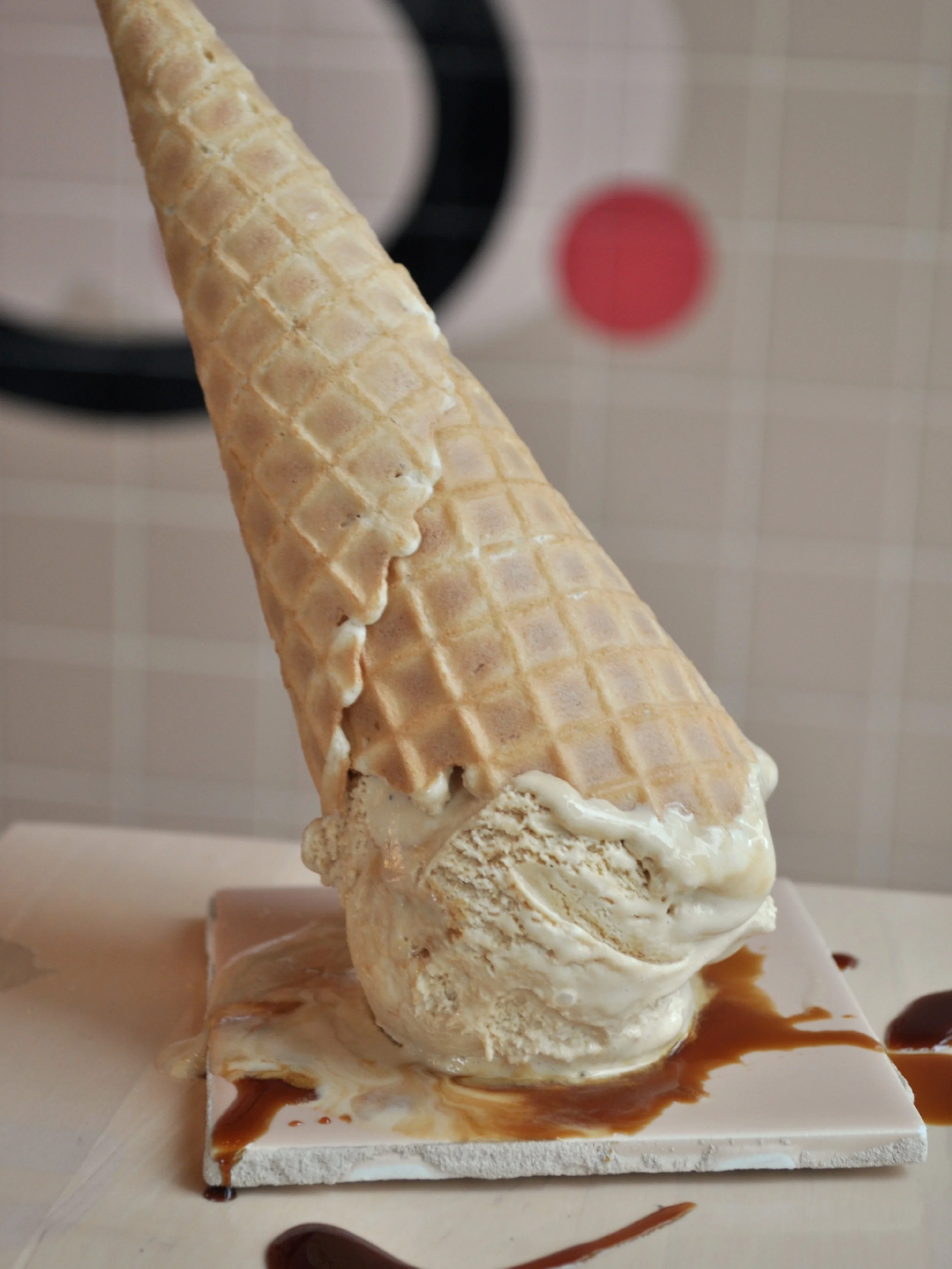 Upside down ice cream cone of the Root Beer flavour with Root Beer syrup.