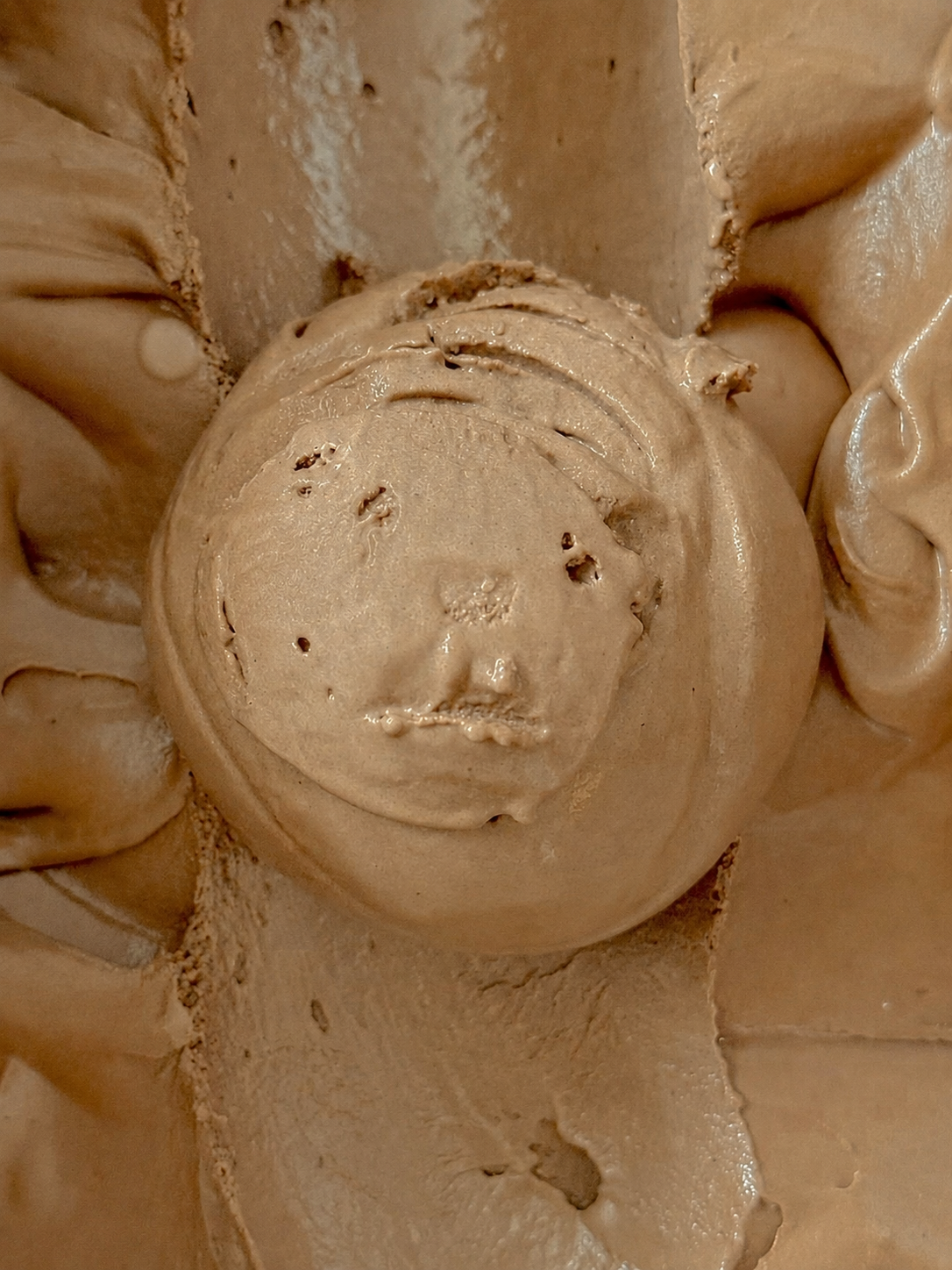 Close up of a brown scoop of Chocolate ice cream