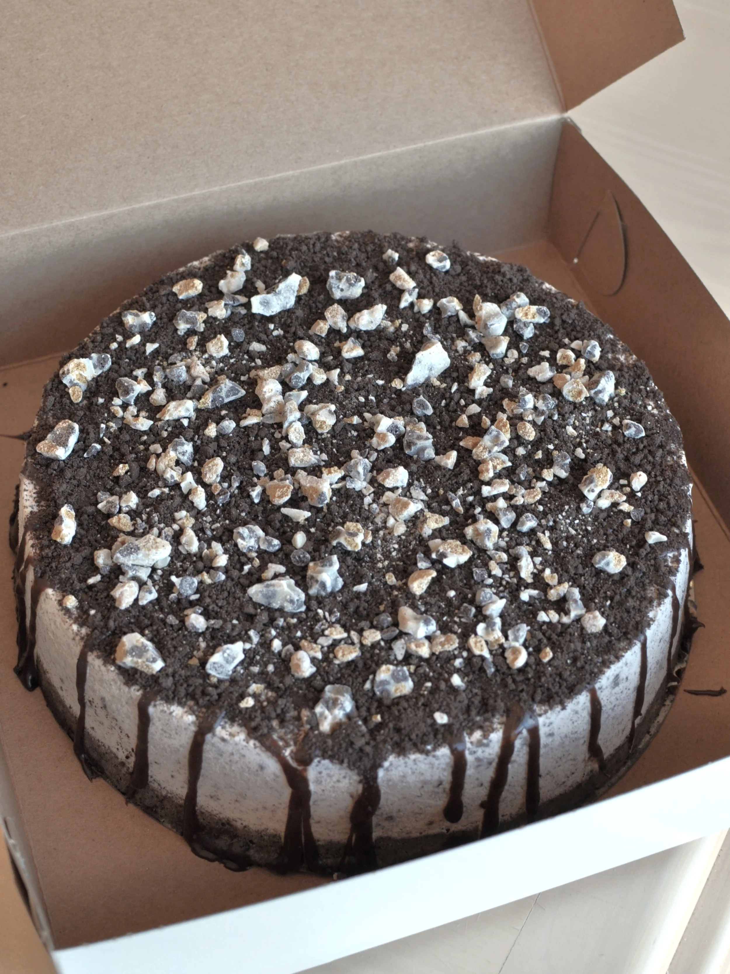 Cookies & Cream ice cream cake with toppings in a box