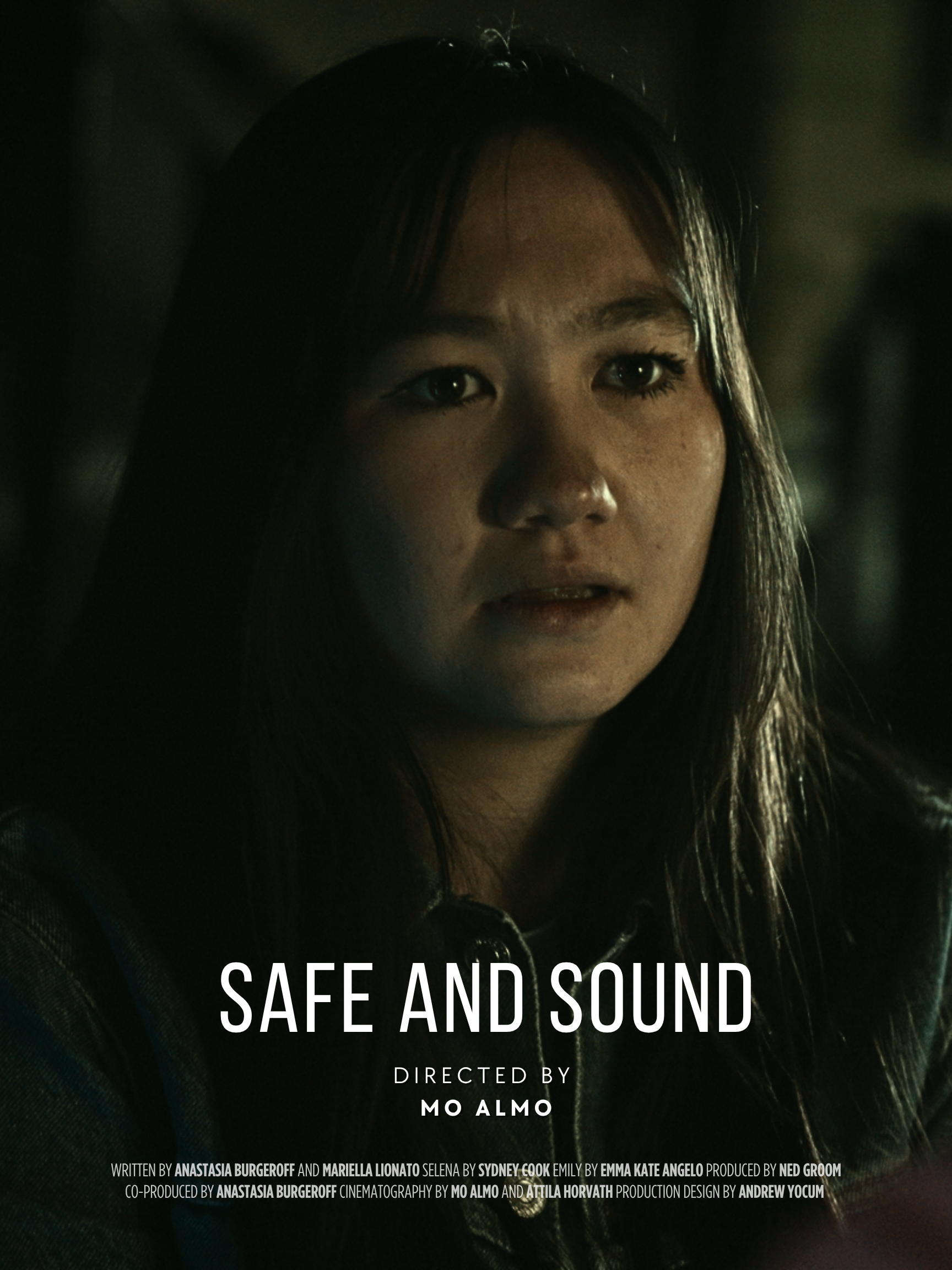 Close-up of a young woman with long dark hair, looking into the camera with a serious expression. The image is dark with subdued lighting. Text overlays include the title "Safe and Sound," director Mo Almo, and credits at the bottom.