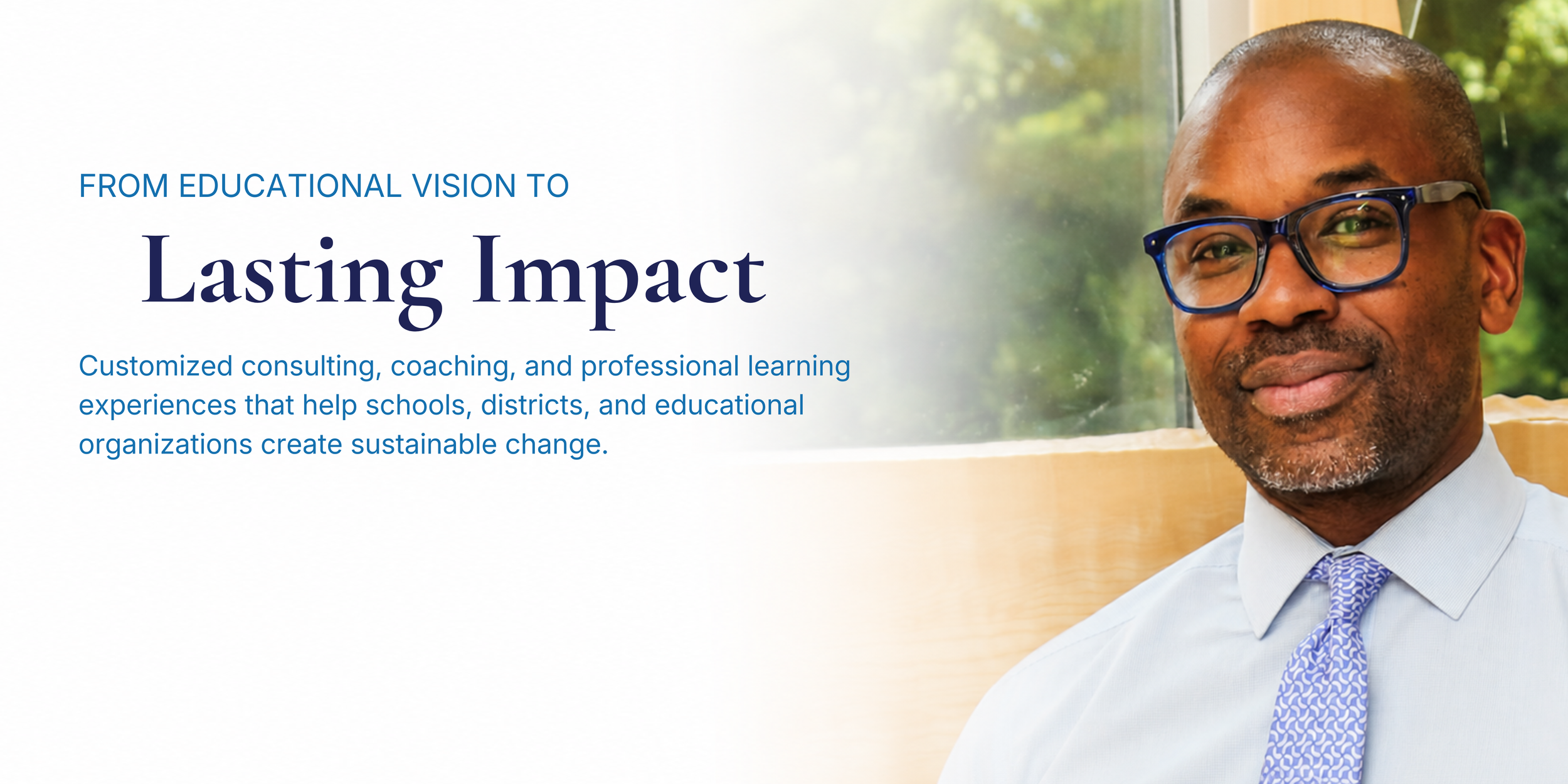 A man in a white shirt and blue patterned tie smiling, wearing black glasses, sitting by a window with a green outdoor scene in the background, accompanying text about educational consulting and professional learning.