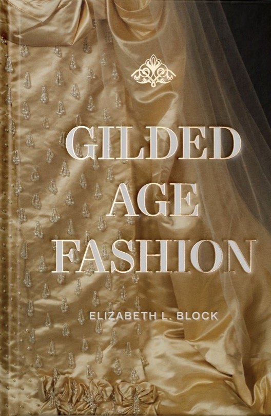 Book cover titled "Gilded Age Fashion" by Elizabeth L. Block, featuring a luxurious gold gown with intricate beaded embellishments.
