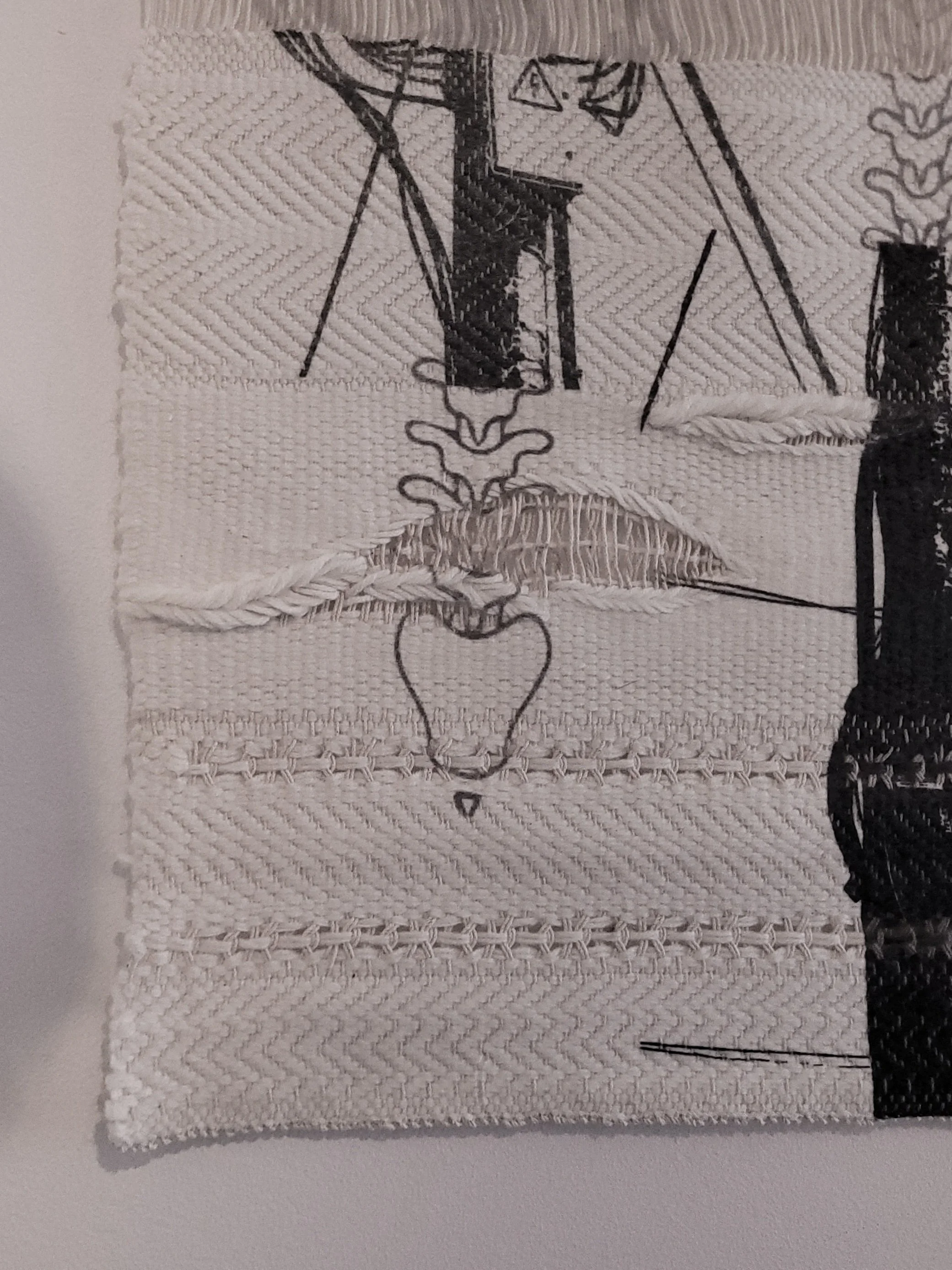 Close up of "Autonomous Vessel," consisting of two large sublimation printed  polyacrylic weave/cotton warp tapestries and seven  small pieces of glass