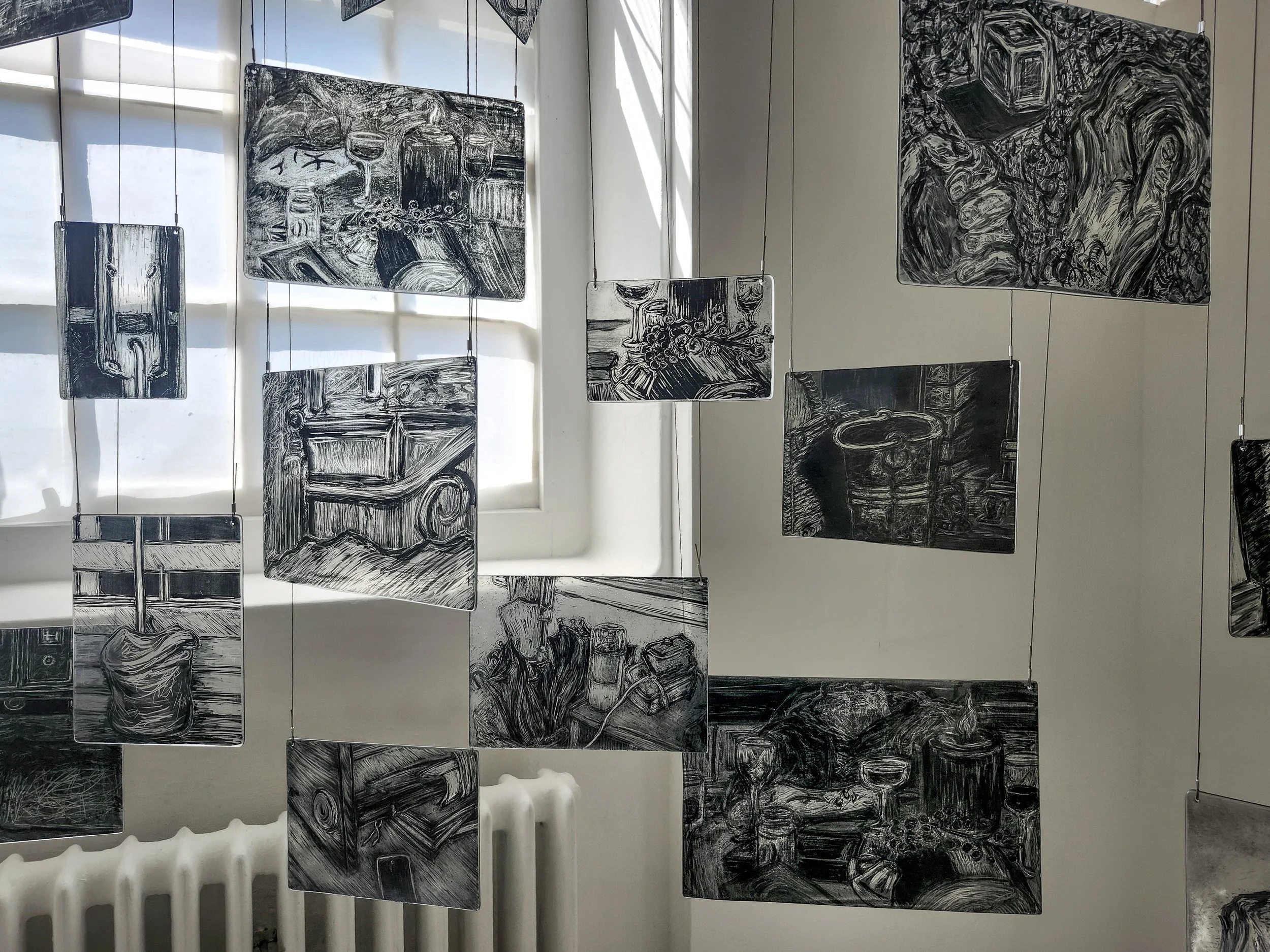 Close up of my memory mobile exhibited during second hand smoke, Trace black sgraffito and painting on horticultural glass