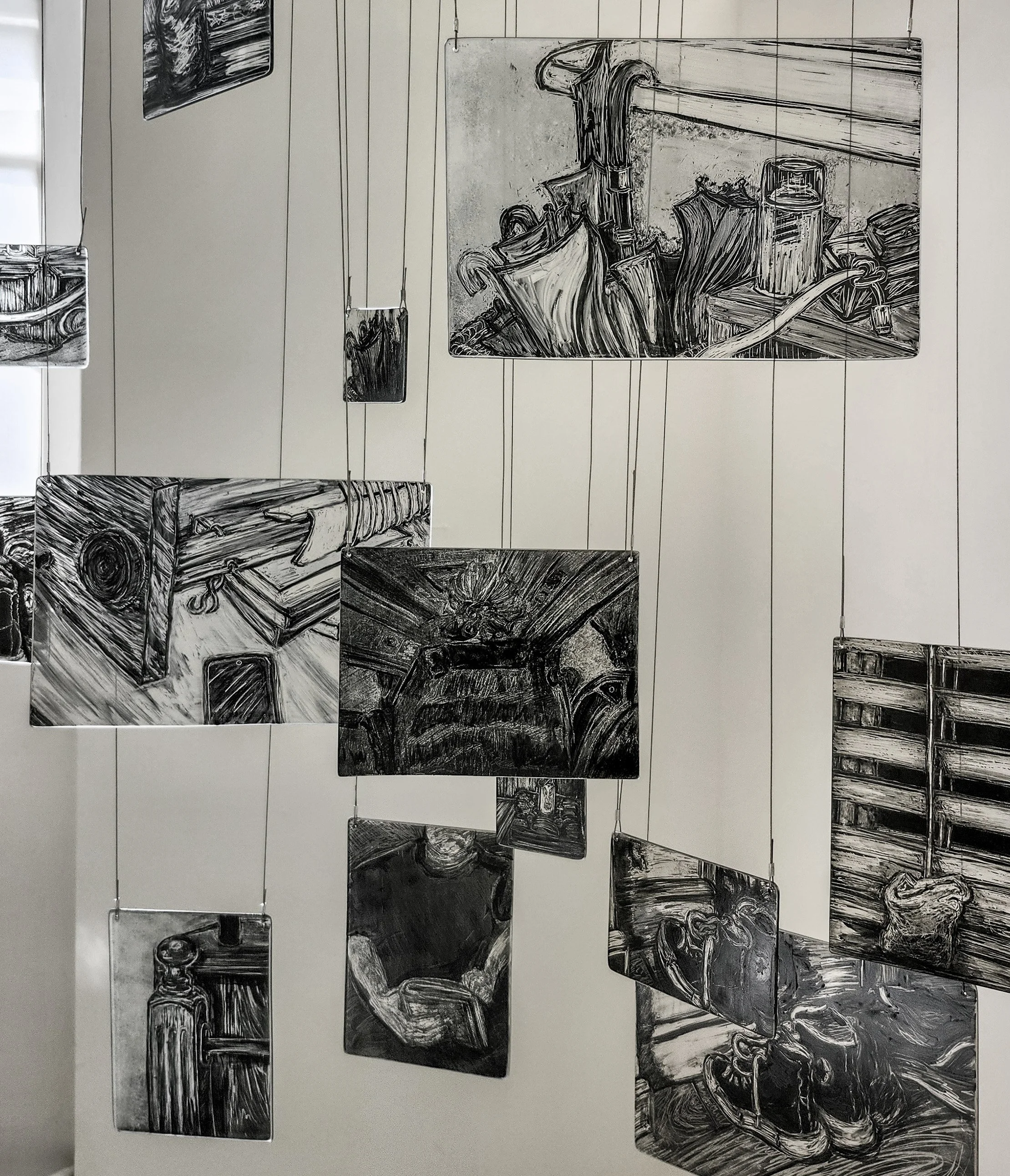 Close up of my memory mobile exhibited during second hand smoke, Trace black sgraffito and painting on horticultural glass