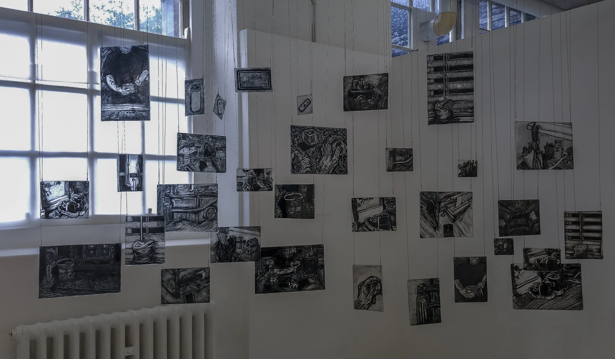 Close up of my memory mobile exhibited during second hand smoke, Trace black sgraffito and painting on horticultural glass