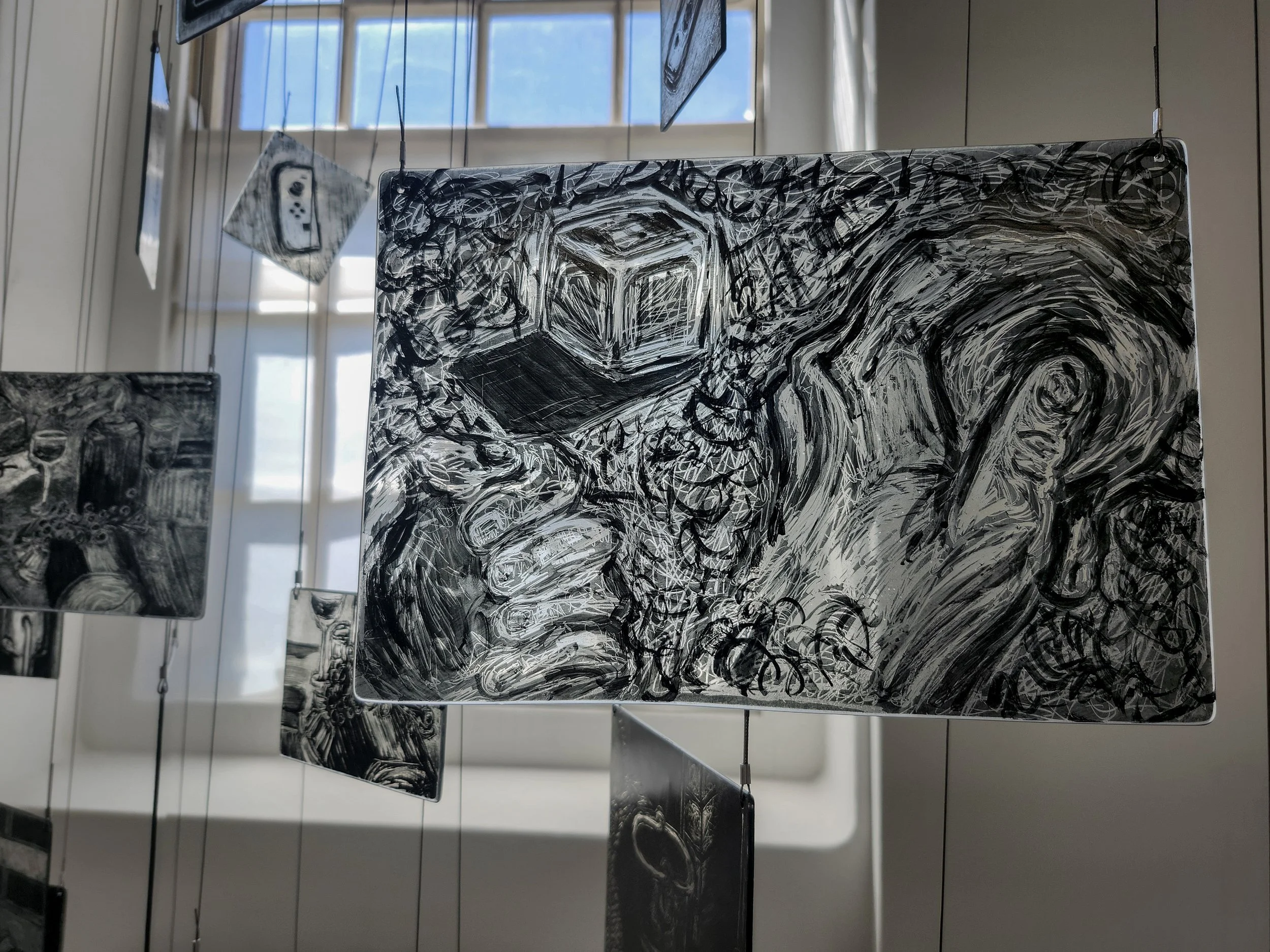 Close up of my memory mobile exhibited during second hand smoke, Trace black sgraffito and painting on horticultural glass