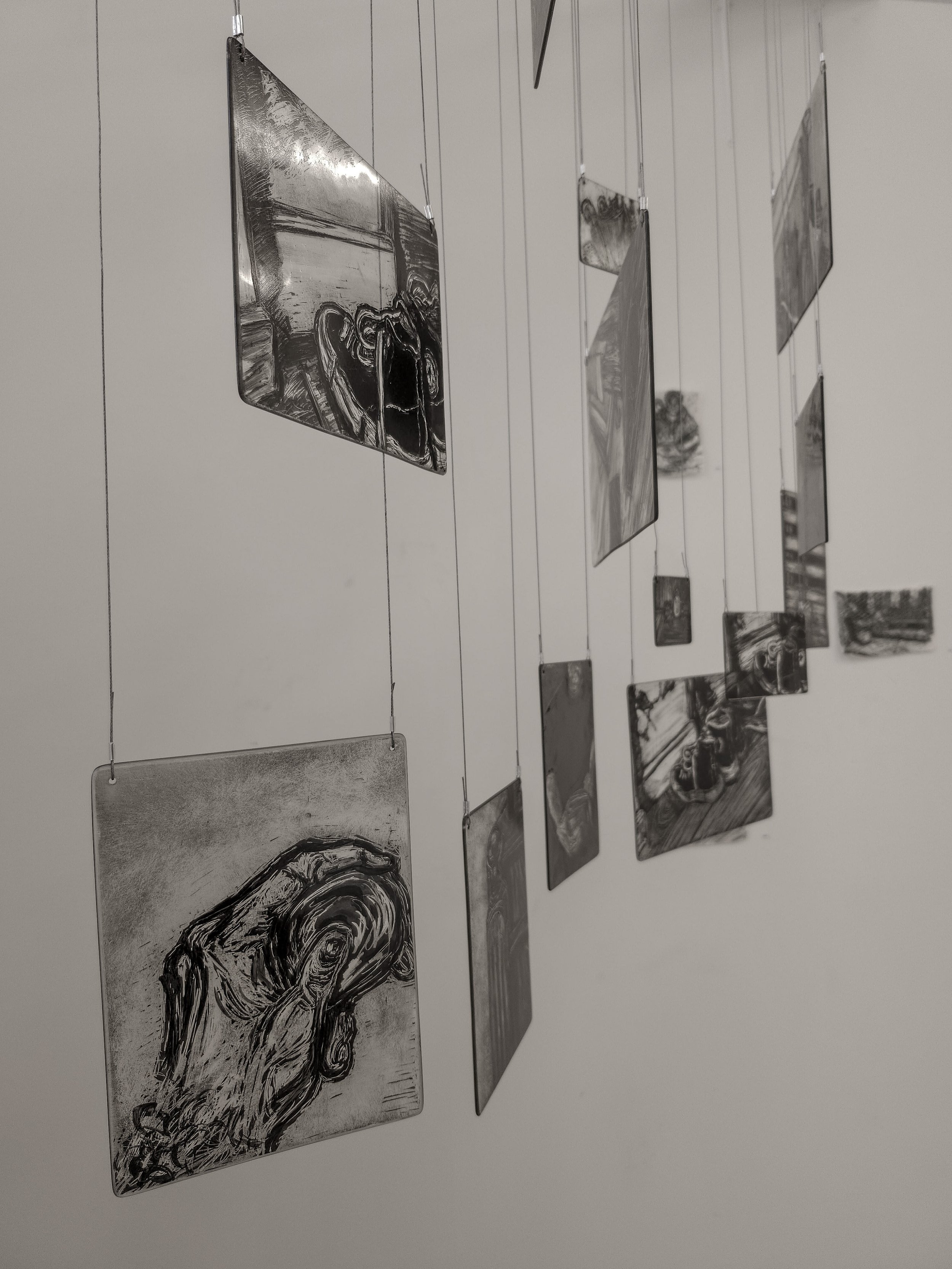 Close up of my memory mobile exhibited during second hand smoke, Trace black sgraffito and painting on horticultural glass