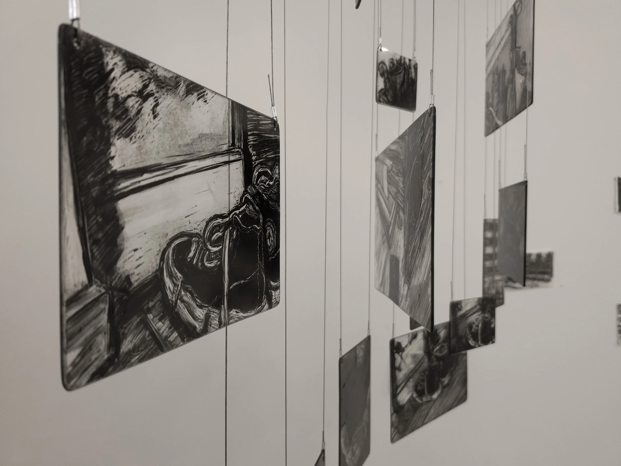 Close up of my memory mobile exhibited during second hand smoke, Trace black sgraffito and painting on horticultural glass