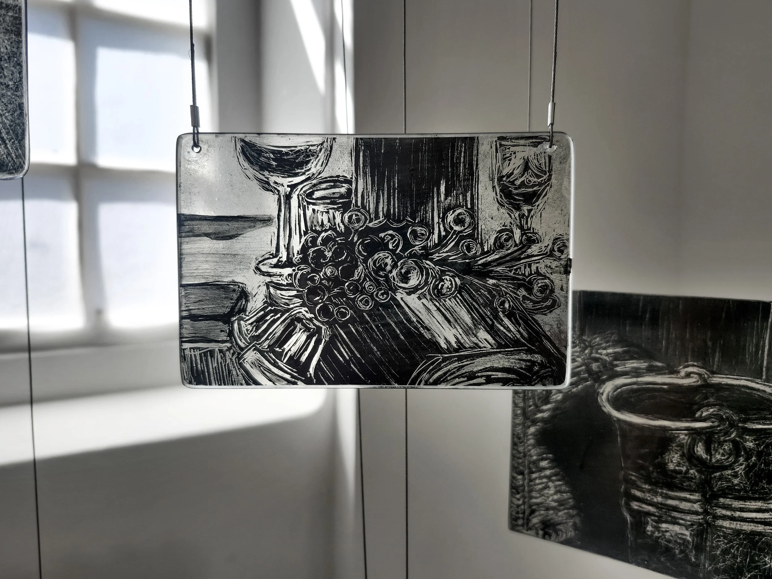 Close up of my memory mobile exhibited during second hand smoke, Trace black sgraffito and painting on horticultural glass