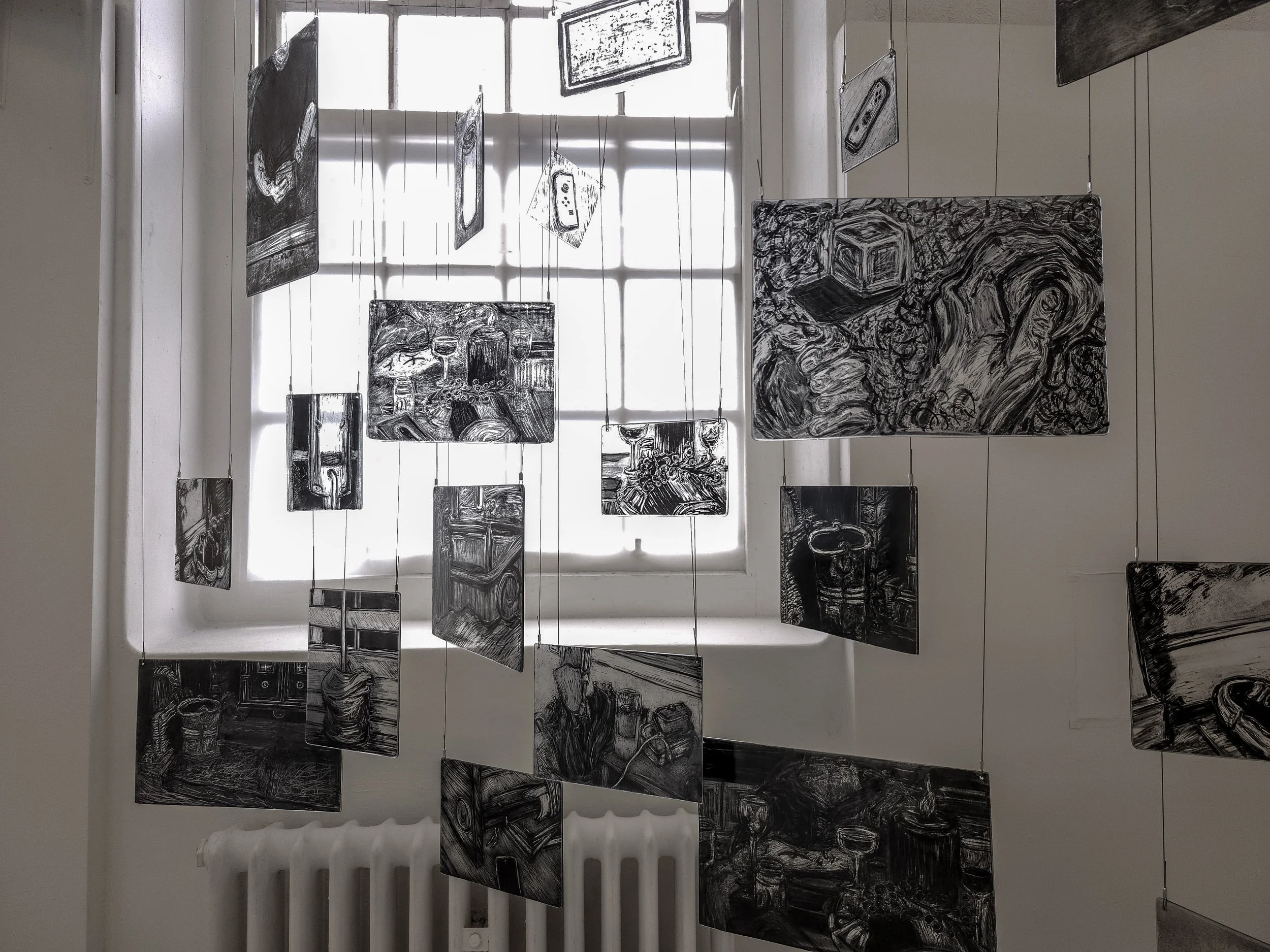 Close up of my memory mobile exhibited during second hand smoke, Trace black sgraffito and painting on horticultural glass