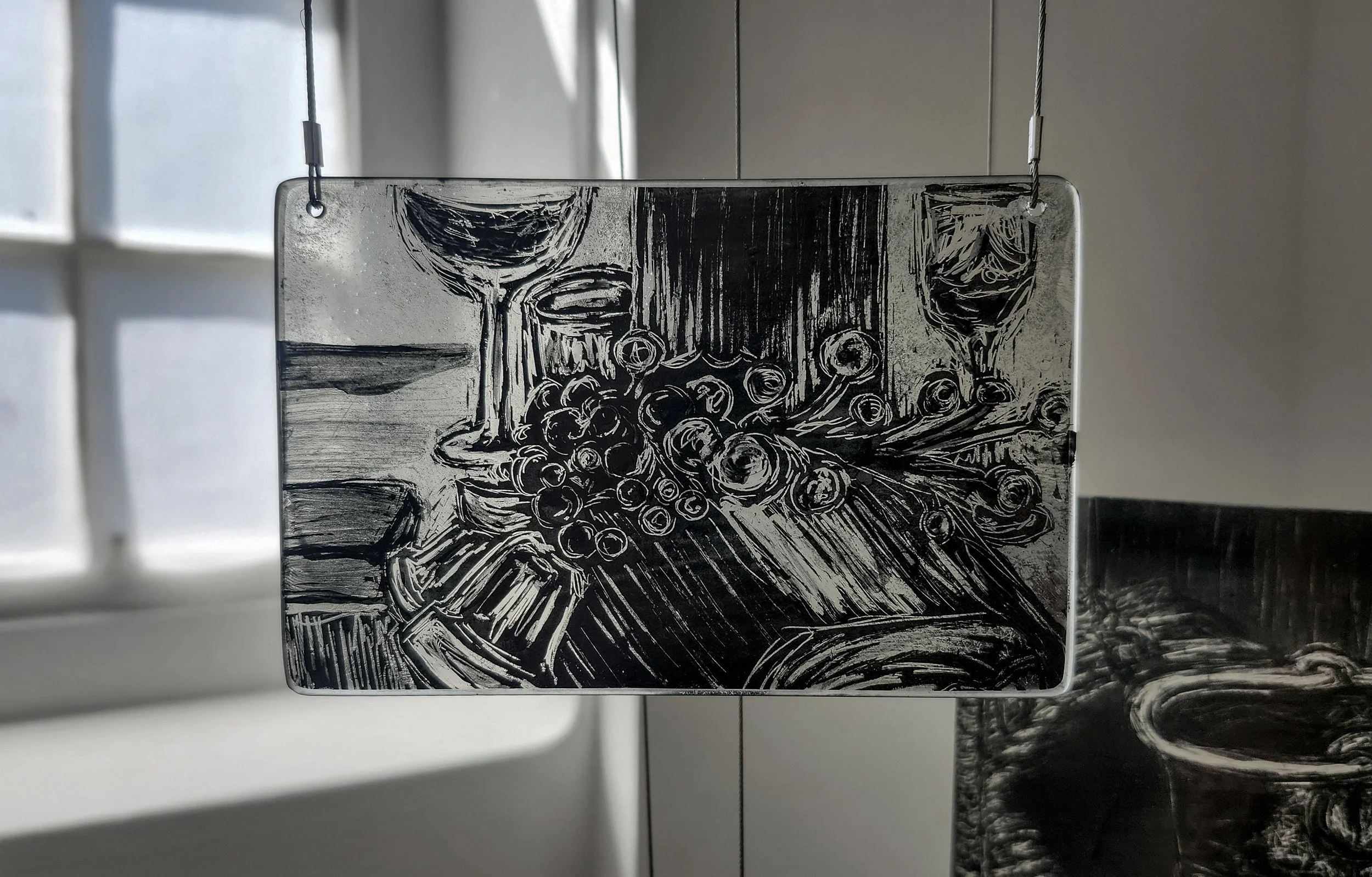 "Yule Log," 2026, Sgrafitto and glass painting on horticultural glass