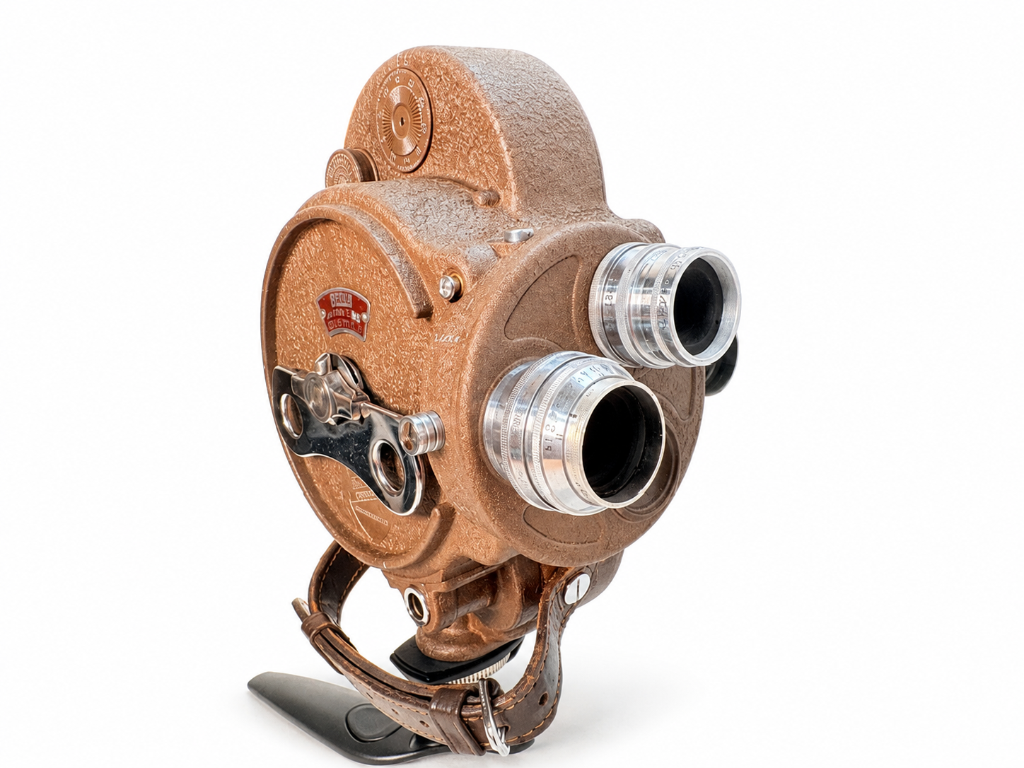 Bell & Howell Filmo 70-DA vintage 16mm mechanical film camera on a white studio background.