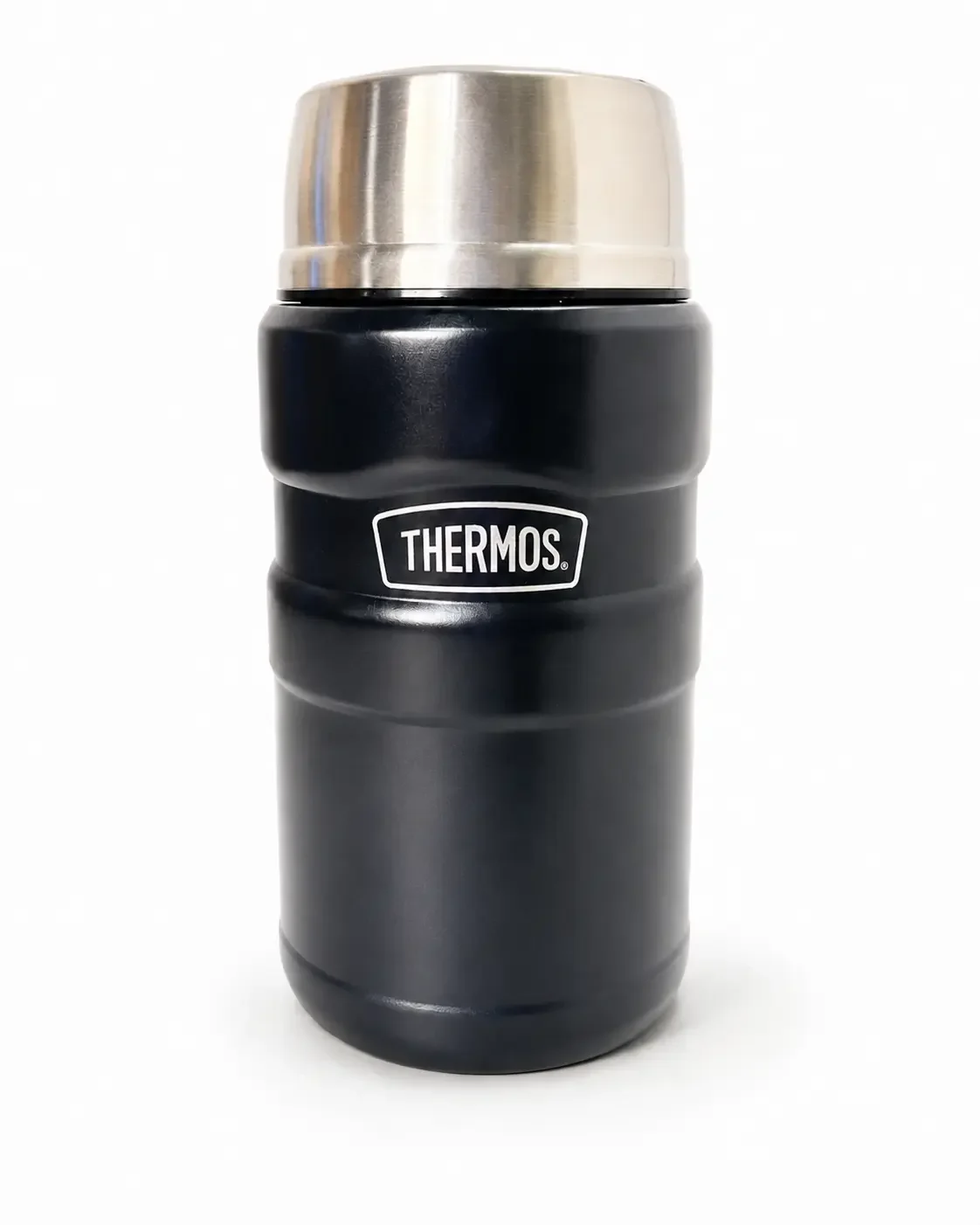 A black Thermos brand vacuum insulated travel mug with a silver lid.