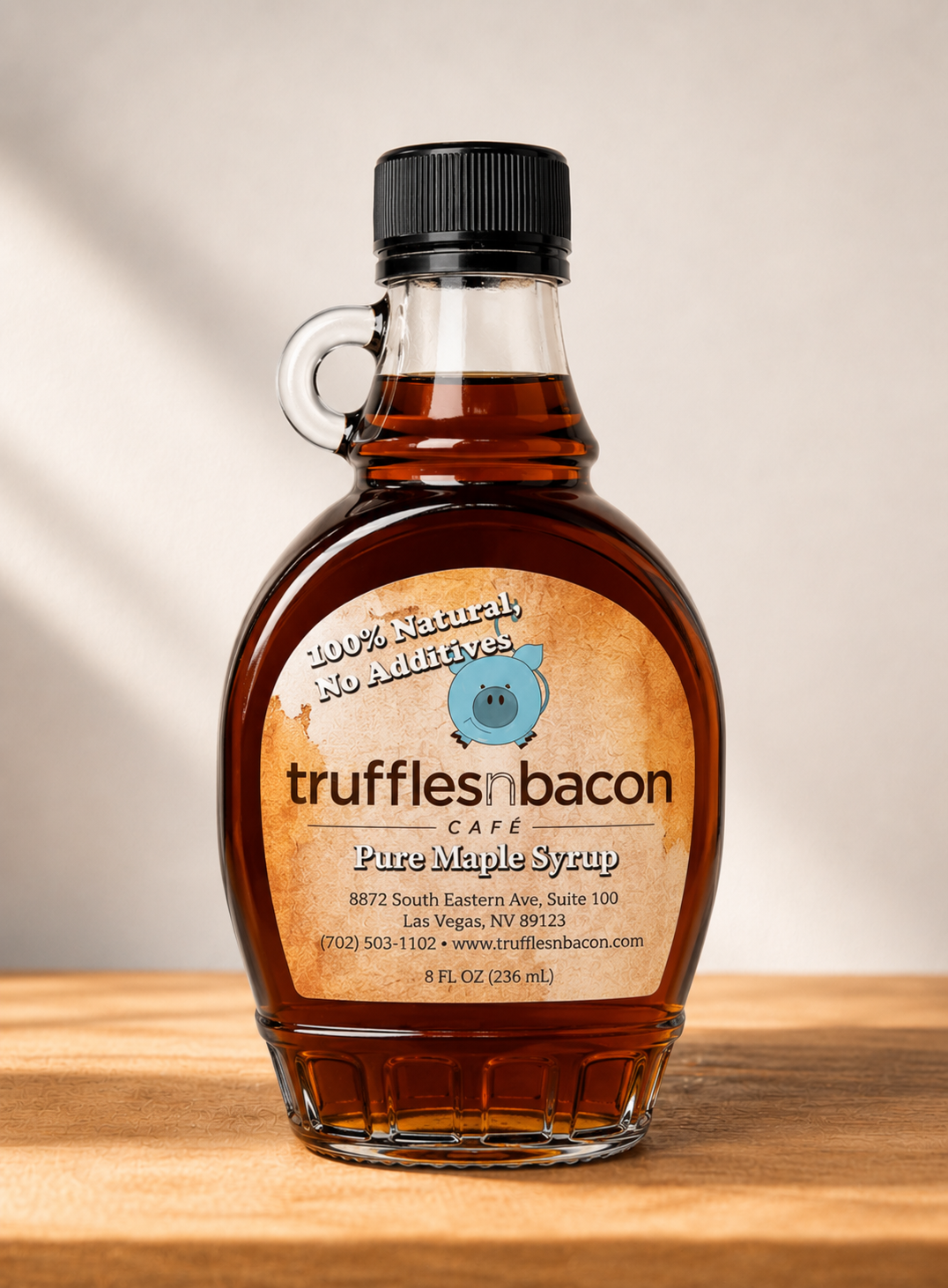 Natural Maple Syrup Bottle on Wood.png