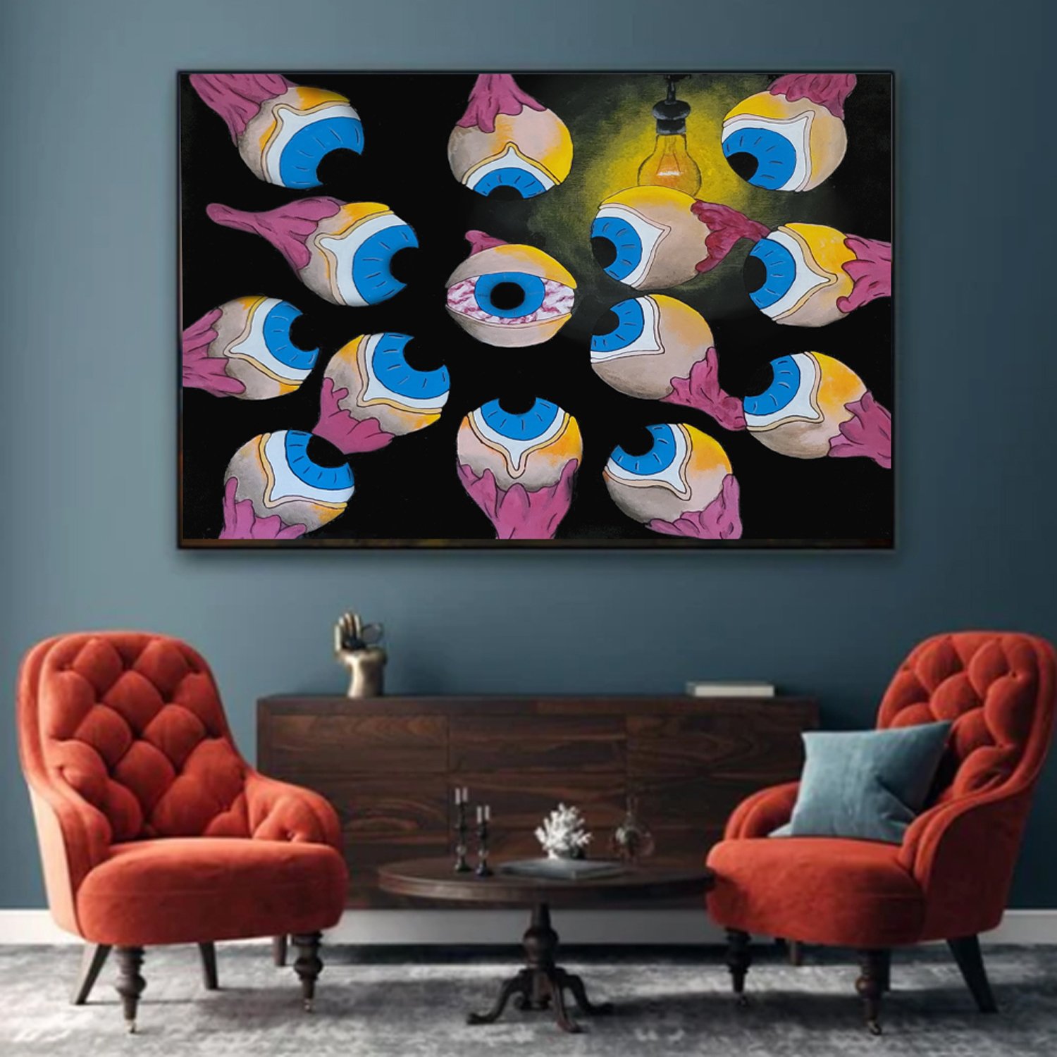 Living room with two orange velvet chairs, a dark wood sideboard, a gray rug, and a large abstract painting of multiple eyes with pink eyelids, blue irises, and a yellow lightbulb in the center of the artwork.