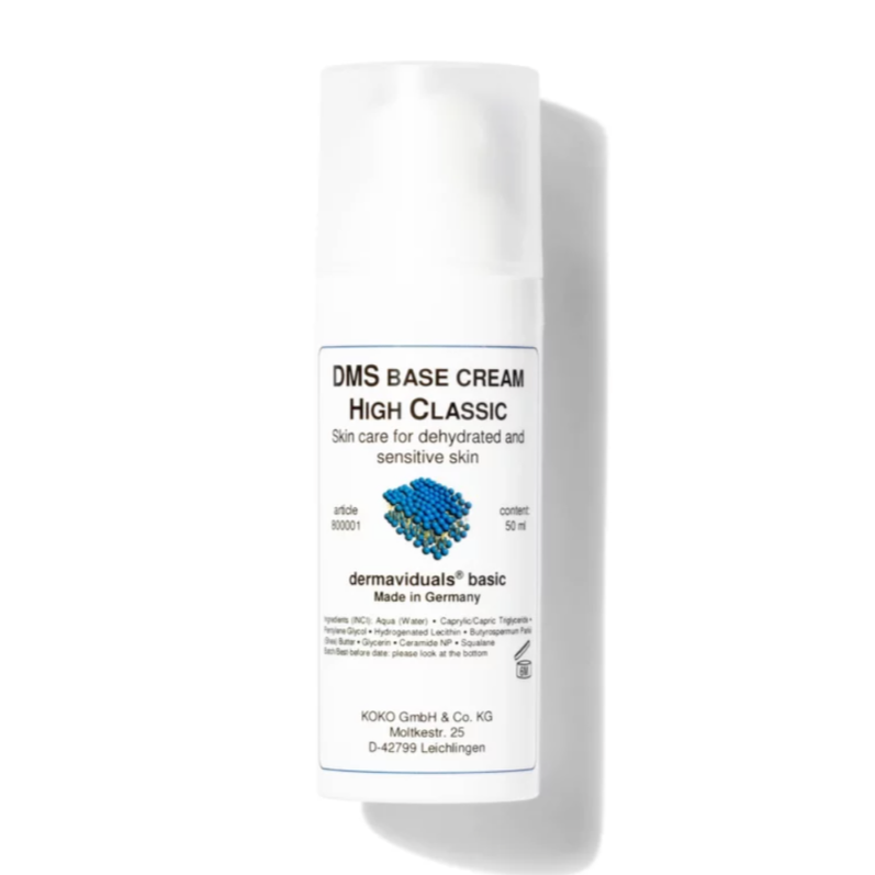 A white bottle of DMS Base Cream High Classic for dehydrated and sensitive skin, made in Germany, with a molecular graphic on the label.