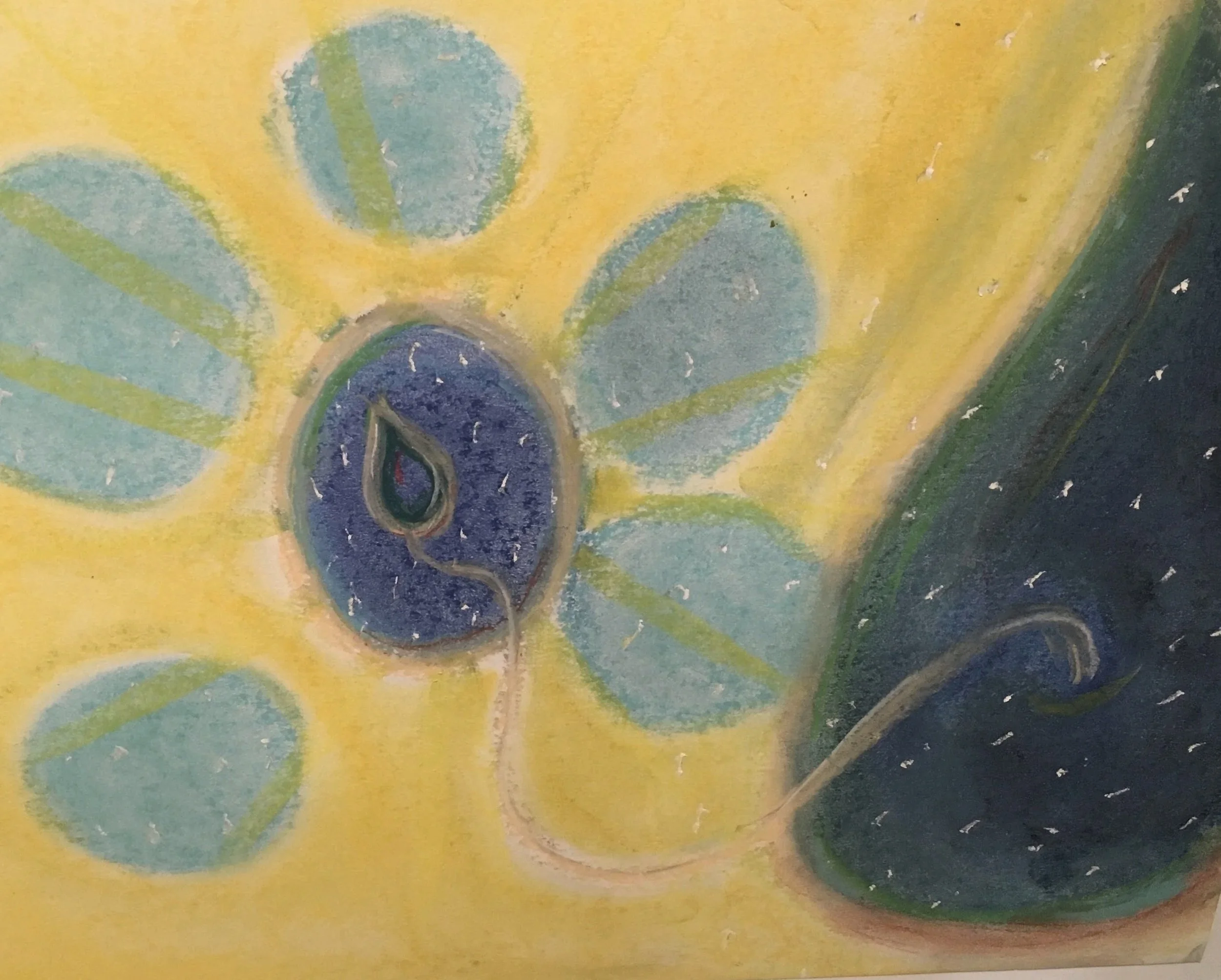 Close-up of a colorful abstract drawing with a yellow background, green and blue shapes, and a central dark blue shape with a red tip, possibly resembling a stylized flower or butterfly.