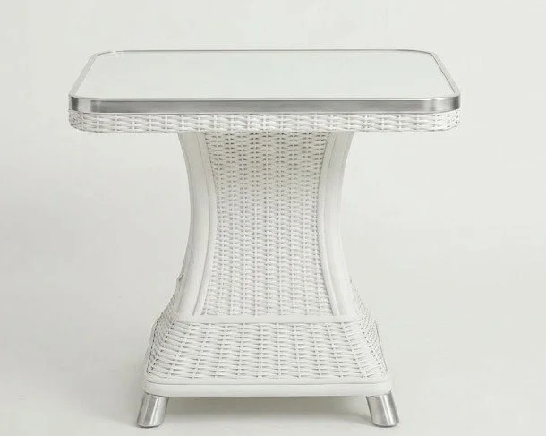 Modern white wicker side table with a clean square design, metallic trim, and a smooth glass top surface