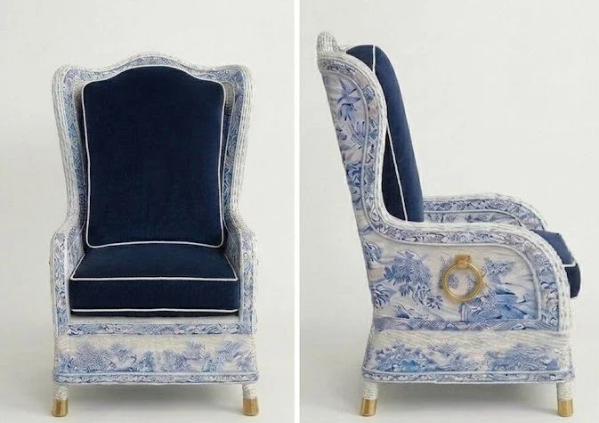 Two views of a luxury armchair features a detailed blue and white Chinoiserie fabric pattern covering the frame, deep navy blue velvet cushions with white piping, gold ring handles, and brass-capped legs.