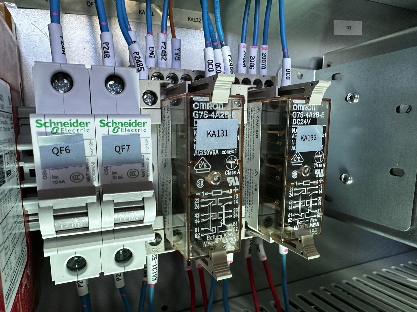 Omron G7S safety relays and Schneider circuit breakers in a Taikan machine cabinet