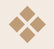 A geometric pattern of four brown diamonds arranged around a central empty space on a light background.