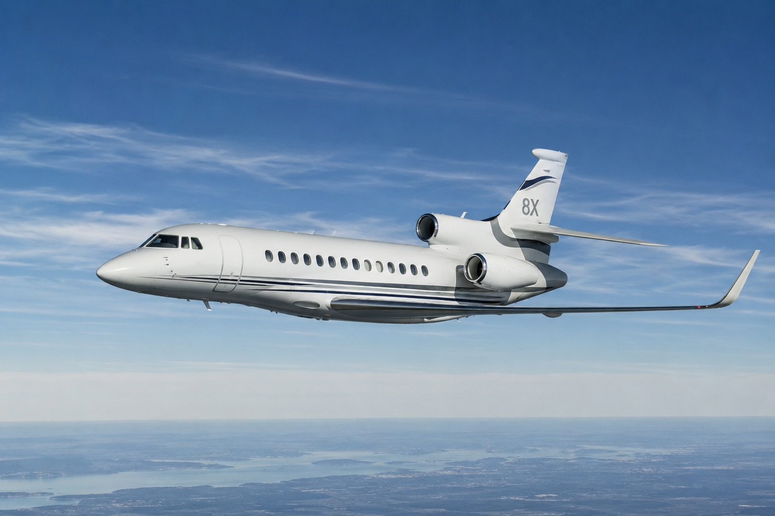 A private jet flying high in the sky with a blue sky and clouds in the background.
