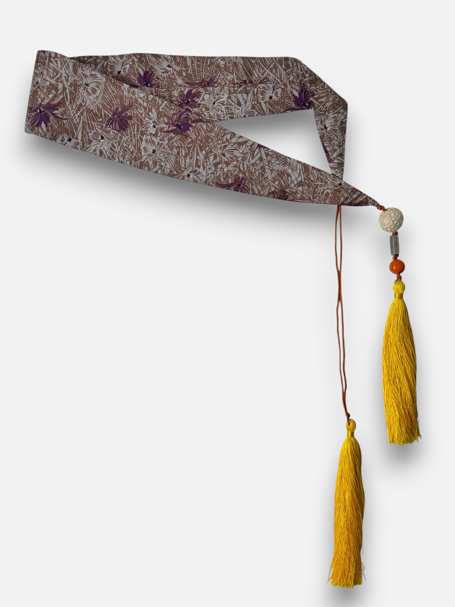 brown floral wirh purle and yellow tassels.png