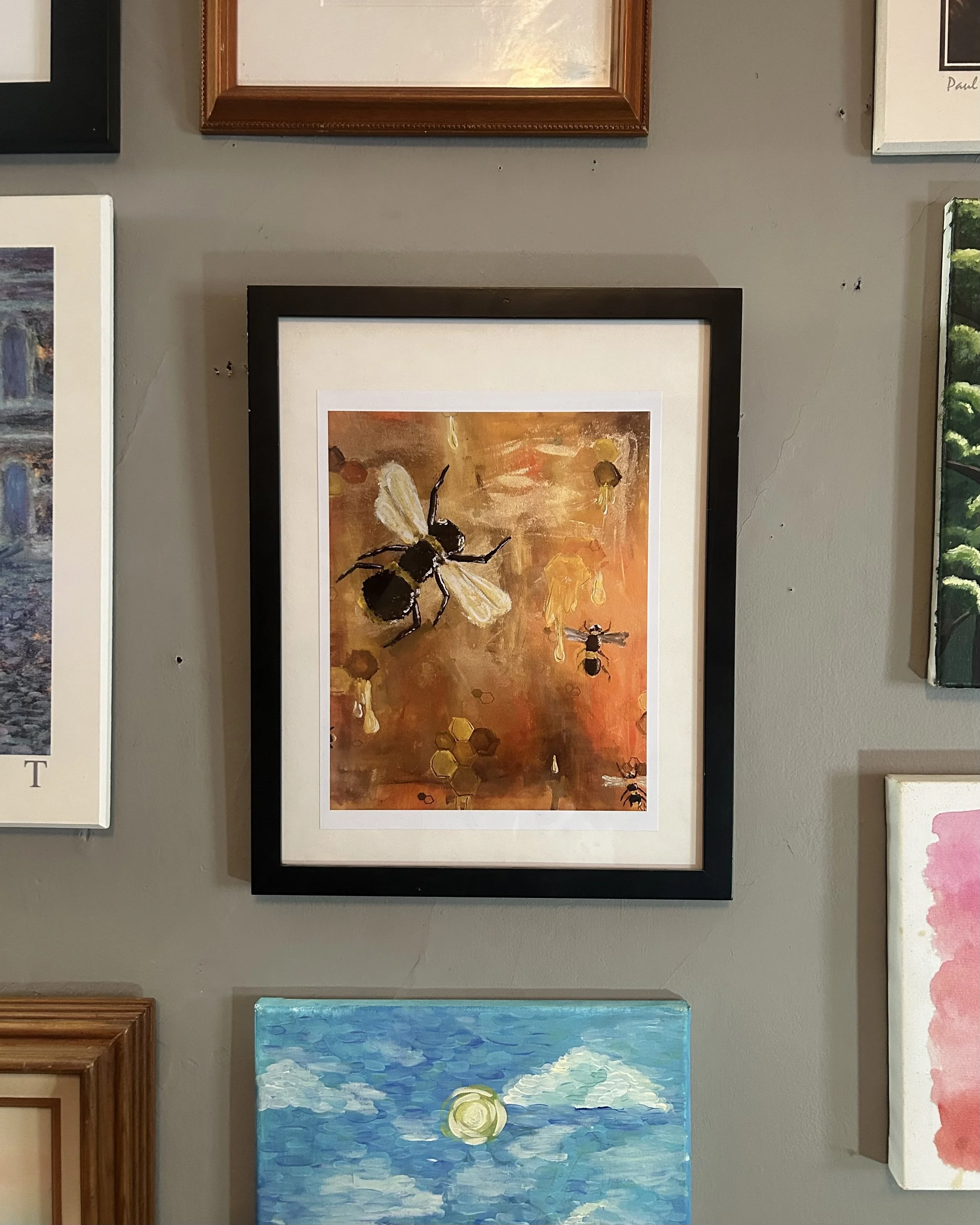 Painting of bees and honeycombs on a warm, honey-colored background, with some bees flying and sitting on honeycomb structures.