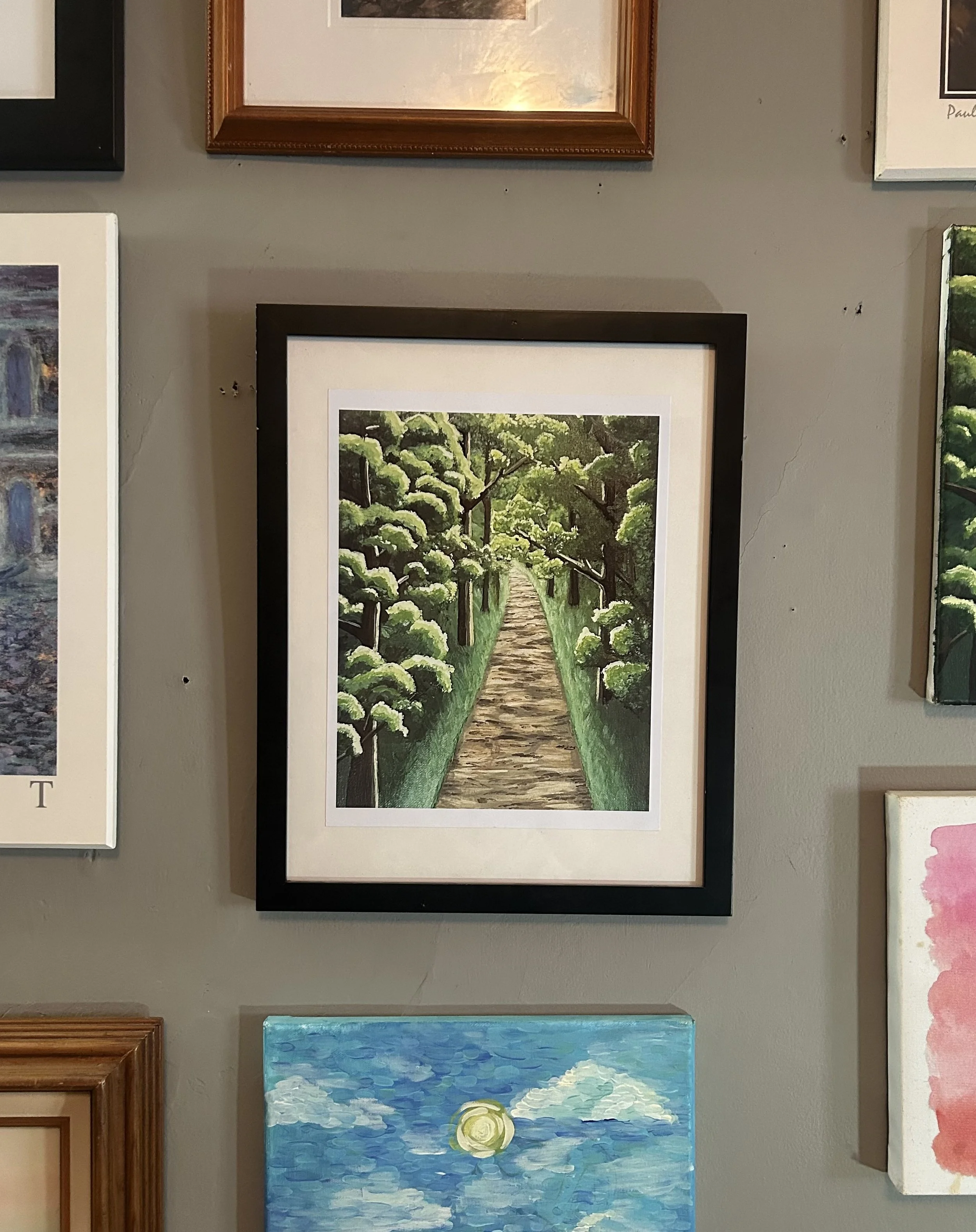 A painting of a pathway through a green vineyard with lush leafy grapevines on both sides.