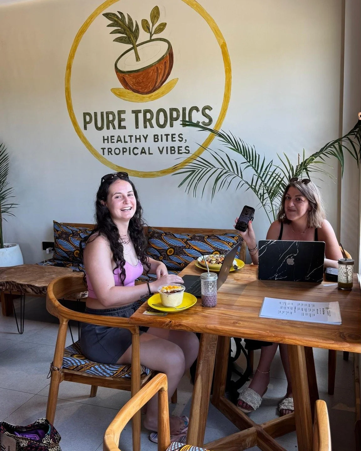 The ultimate 'out of office' setup. 🌴💻 Mixing a little business with a lot of tropical pleasure over brunch. Fueling creativity one smoothie bowl at a time at Pure Tropics. Who else needs a change of scenery? ☀️🍍

#PureTropics #HealthyBites #Tropi